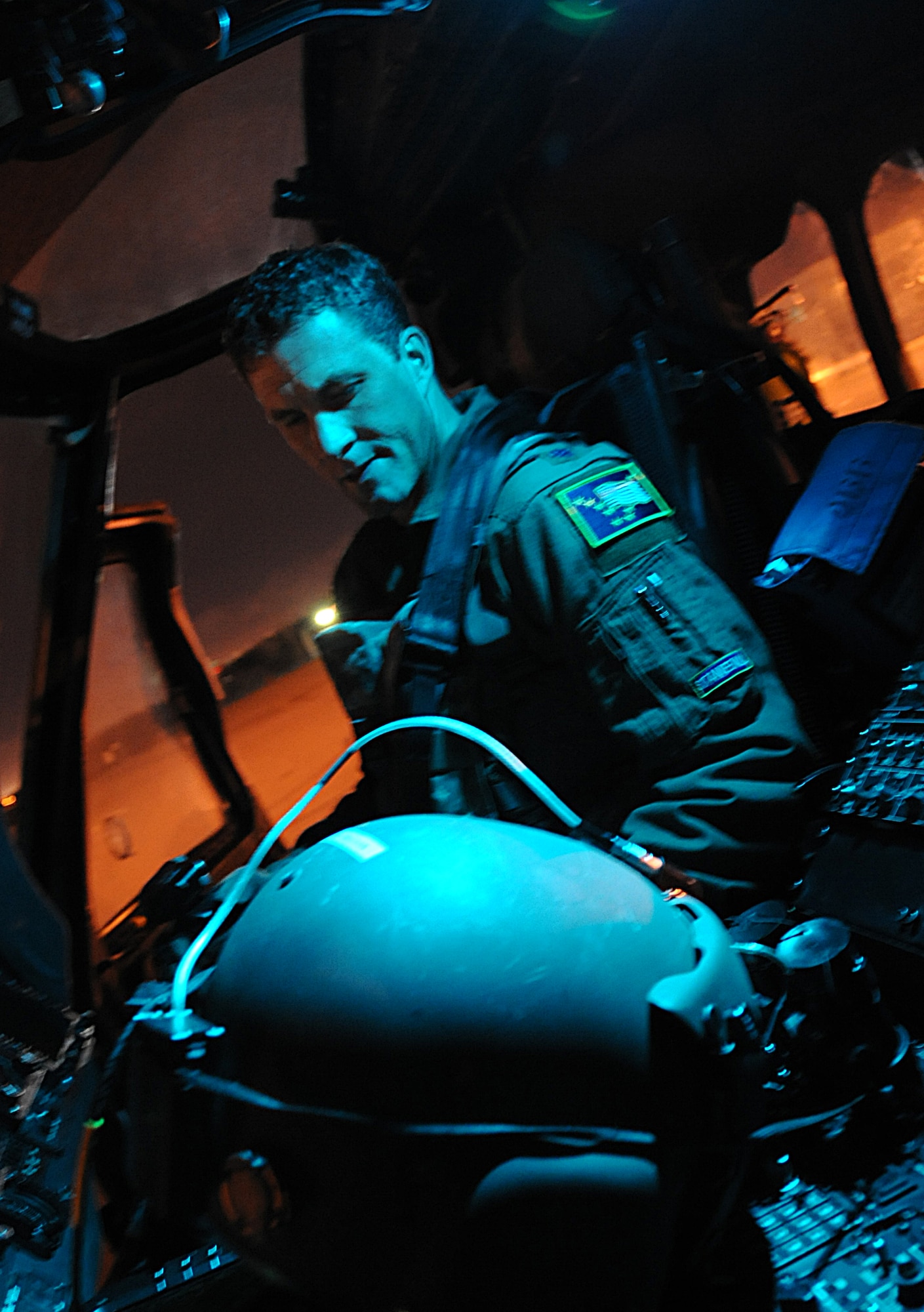 KULIS AIR NATIONAL GUARD BASE, Alaska --Lt. Col. William Sullivan prepares for night time training operations in an HH-60G Pavehawk before takeoff Nov. 5. Most rescue training operations occur during the nighttime hours which help guardsmen become more efficient and increase survivability in combat. Sullivan is the chief of standardization/evaluation from Pacific Air Forces Headquarters Hickam AFB, Hawaii. (U.S. Air Force photo/Senior Airman Cynthia Spalding)