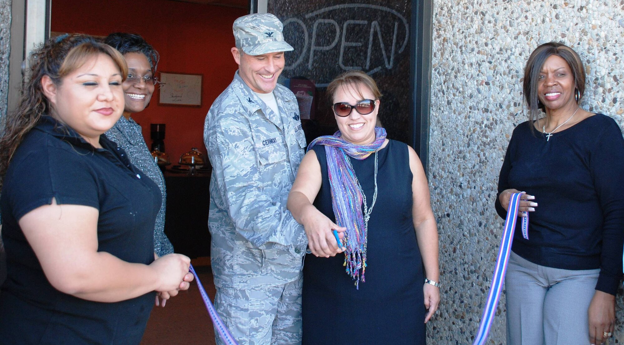 LAUGHLIN AIR FORCE BASE, Texas – Col. Andrew Cernicky, 47th Mission Support Group commander, and Danielle’s Frozen Custard Shop owner Sharon Medina cut the ceremonial ribbon to recognize the opening of the shop here Nov. 6. Danielle’s offers many dessert and coffee drink options as well free Wi-Fi and patio seating. (U.S. Air Force photo by Kaley Briesmaster)  