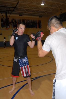 Airman 1st Class Dylan Senecal, 43rd Communications Squadron, practices mixed martial arts techniques in preparation of his upcoming competition that will take place at the National Guard Armory in Greenville, N.C. (U.S. Air Force Photo by 2nd Lt. Cammie Quinn)