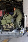 TEL AVIV, Israel -- Air Force Reserve Staff Sgt. Kern Smith, a loadmaster assigned to the 773rd Airlift Squadron, based at Youngstown Air Reserve Station, Ohio, prepares to unstrap baggage on the cargo ramp of a C-130H Hercules tactical cargo transport aircraft also assigned to the 910th, on the tarmac of Ben Gurion International Airport here, October 25, 2009. Sergeant Smith and eight other Citizen Airmen from YARS have just landed here on an airlift mission from Naples, Italy transporting 29 passengers from the Naval Air Station there. The 910th Airmen completing this airlift mission are among more than 70 Servicemembers from YARS attached to the 38th Expeditionary Airlift Squadron, based at Ramstein. The 38th EAS is supporting Operation Joint Enterprise by providing tactical airlift capability to locations in the U.S. Europe Command (EUROCOM), U.S. Africa Command (AFRICOM) and U.S. Central Command (CENTCOM) theaters of operations. U.S. Air Force photo by Master Sgt. Bob Barko Jr. 
