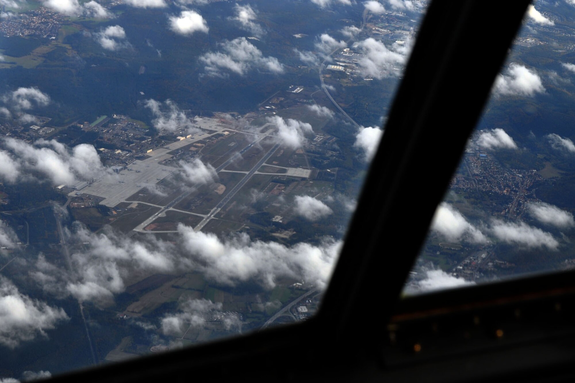ABOVE RAMSTEIN AIR BASE, Germany -- The crew of an Air Force Reserve C-130H Hercules tactical cargo transport aircraft look down on Ramstein Air Base, Germany as they circle the airfield on an airlift mission bound for Naples, Italy and Tel Aviv, Israel.