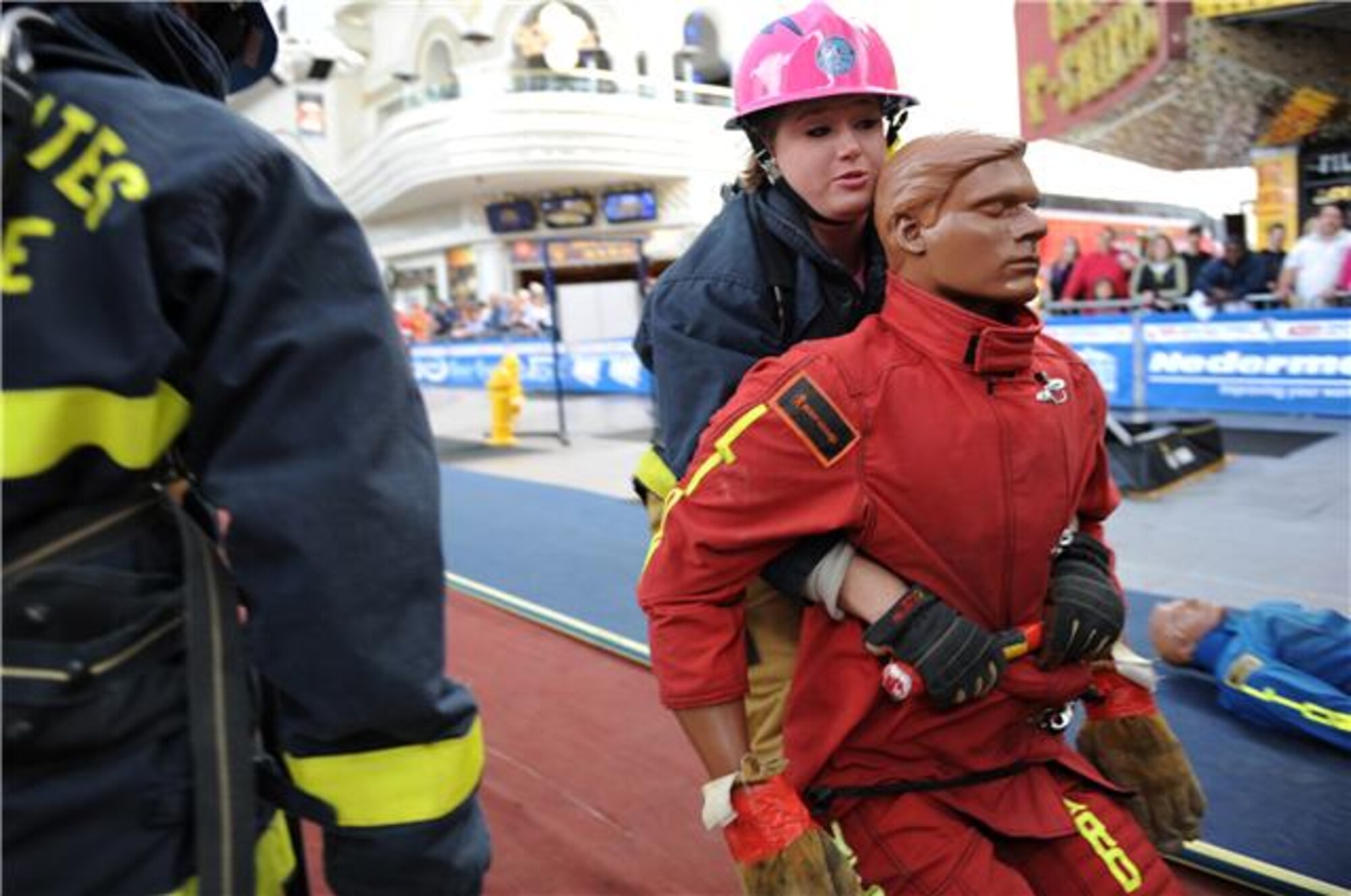 Airman 1st Class Jessica Morehouse pulls a 175 pound dummy as she competes in the team relay event Nov. 18, 2009 at the Scott Firefighter Combat Challenge in Las Vegas. Airman Morehouse is assigned to the Air Force Academy, Colorado Springs, Colo. (U.S. Air Force photo/Staff Sgt. Desiree N. Palacios)