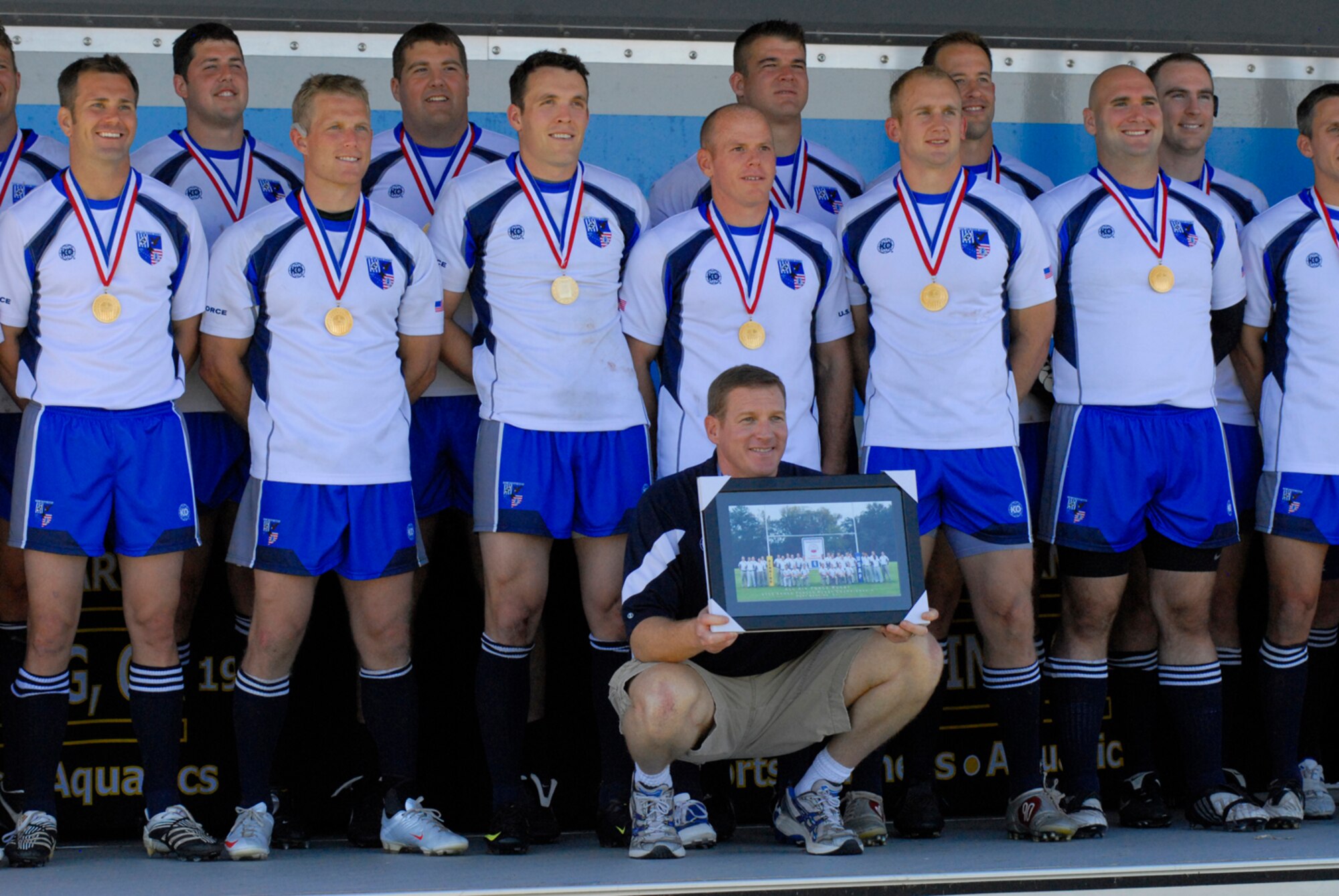 TSgt. Scott Marchant (back row, middle), along with his Air Force Rugby Championship teammates received gold medals for their overwhelming point win against the sister services.  Marchant attributes being able to win to staying fit throughout the year. (Photo by Vince Little)