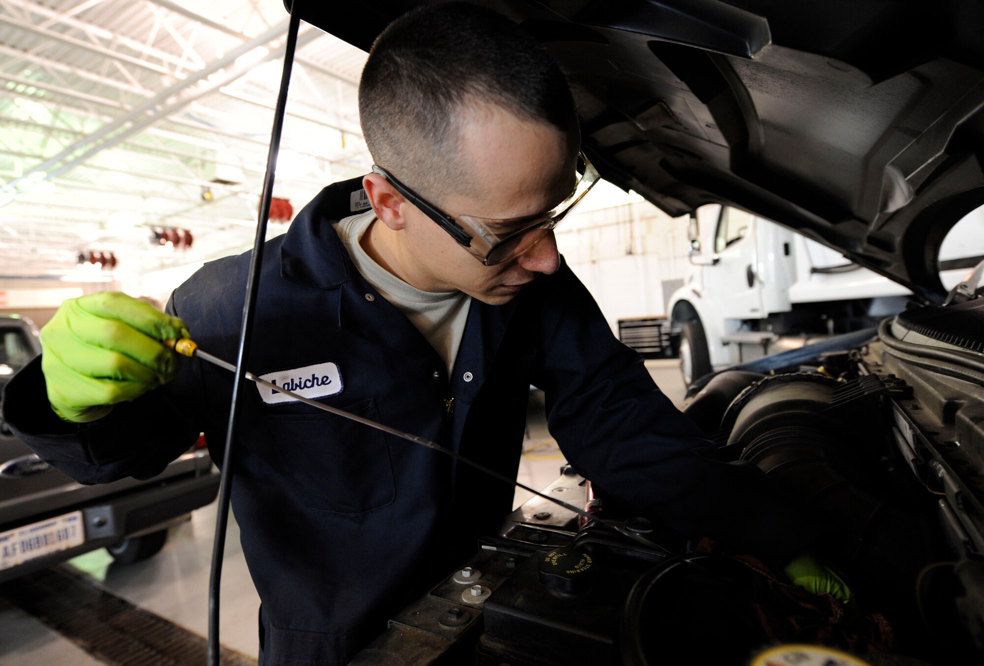LANGLEY AIR FORCE BASE, Va. — Staff Sgt. Michael LaBiche, 1st Logistics Readiness Squadron Vehicle Maintenance technician, inspects a vehicle’s engine fluid for water contamination Nov 19. Vehicle mechanics assessed damage to government-owned vehicles following a nor’easter that struck Langley last week. (U.S. Air Force photo/Senior Airman Dana Hill)