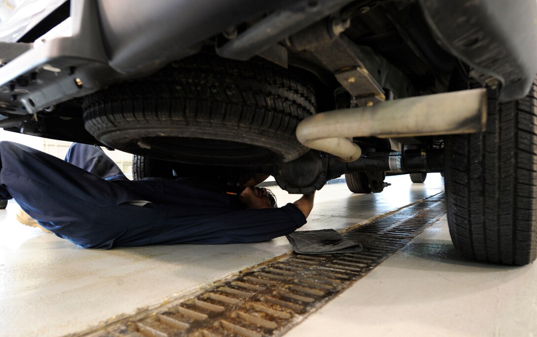 LANGLEY AIR FORCE BASE, Va. — Staff Sgt. Wilbert Josef, 1st Logistics Readiness Squadron Vehicle Maintenance technician, inspects a vehicle for water contamination Nov 19. Vehicle mechanics assessed damage to government-owned vehicles following a nor’easter that struck Langley last week.  (U.S. Air Force photo/Senior Airman Dana Hill)