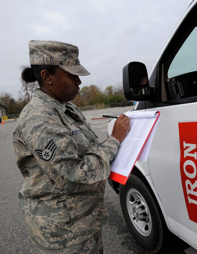 LANGLEY AIR FORCE BASE, Va. — Staff Sgt. Jennifer Foster, 1st Logistics Readiness Squadron Vehicle Management analyst, accounts for vehicles during an inspection Nov 19. Vehicle mechanics assessed damage to government-owned vehicles following a nor’easter that struck Langley last week. (U.S. Air Force photo/Senior Airman Dana Hill)