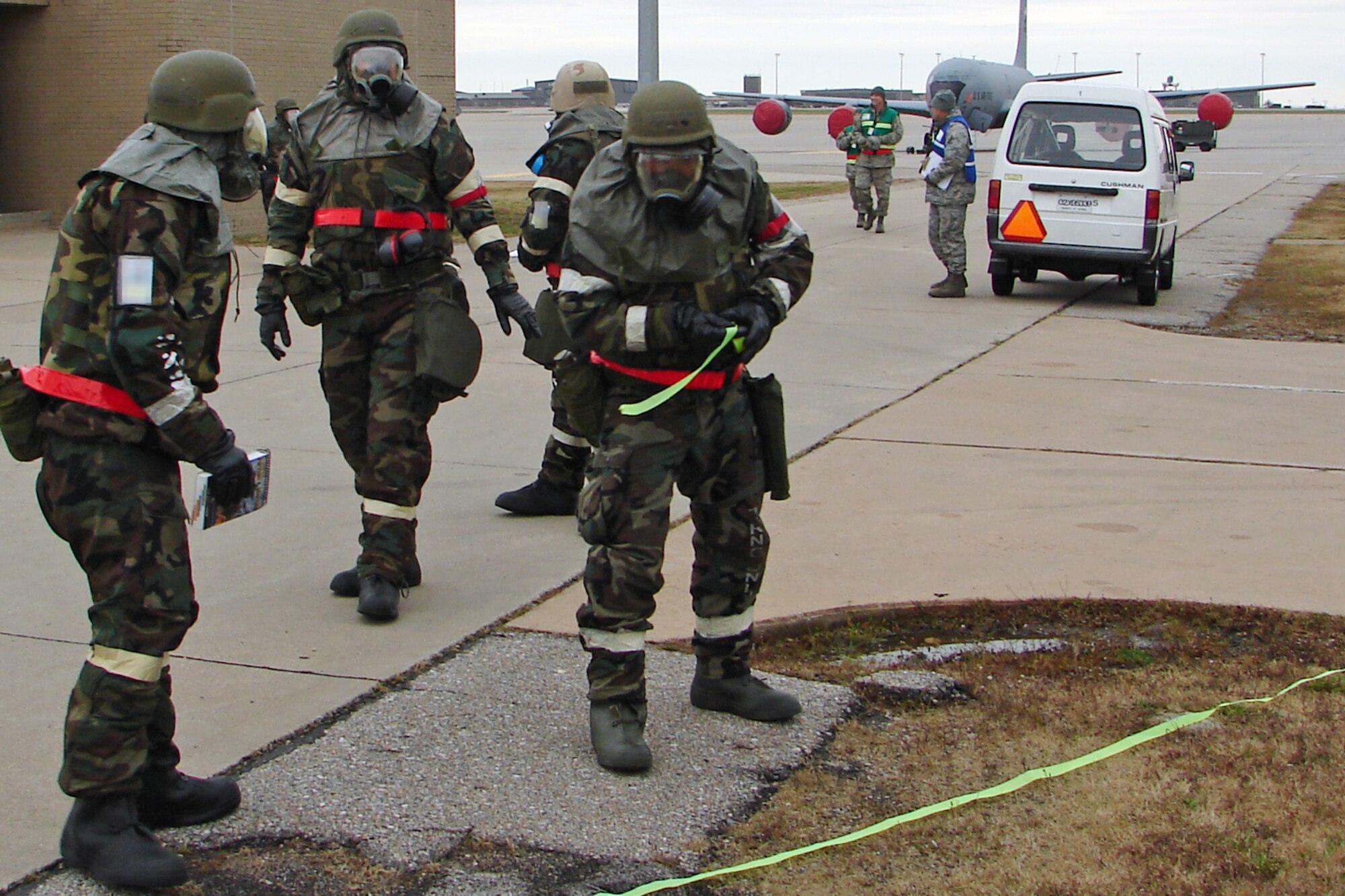 Aircraft maintenance Airmen from the 931st Air Refueling Group mark off a potentially dangerous area during a readiness exercise at McConnell Air Force Base, Kan., on Nov. 17. (U.S. Air Force photo/Staff Sgt. Matthew Jocoy)                  