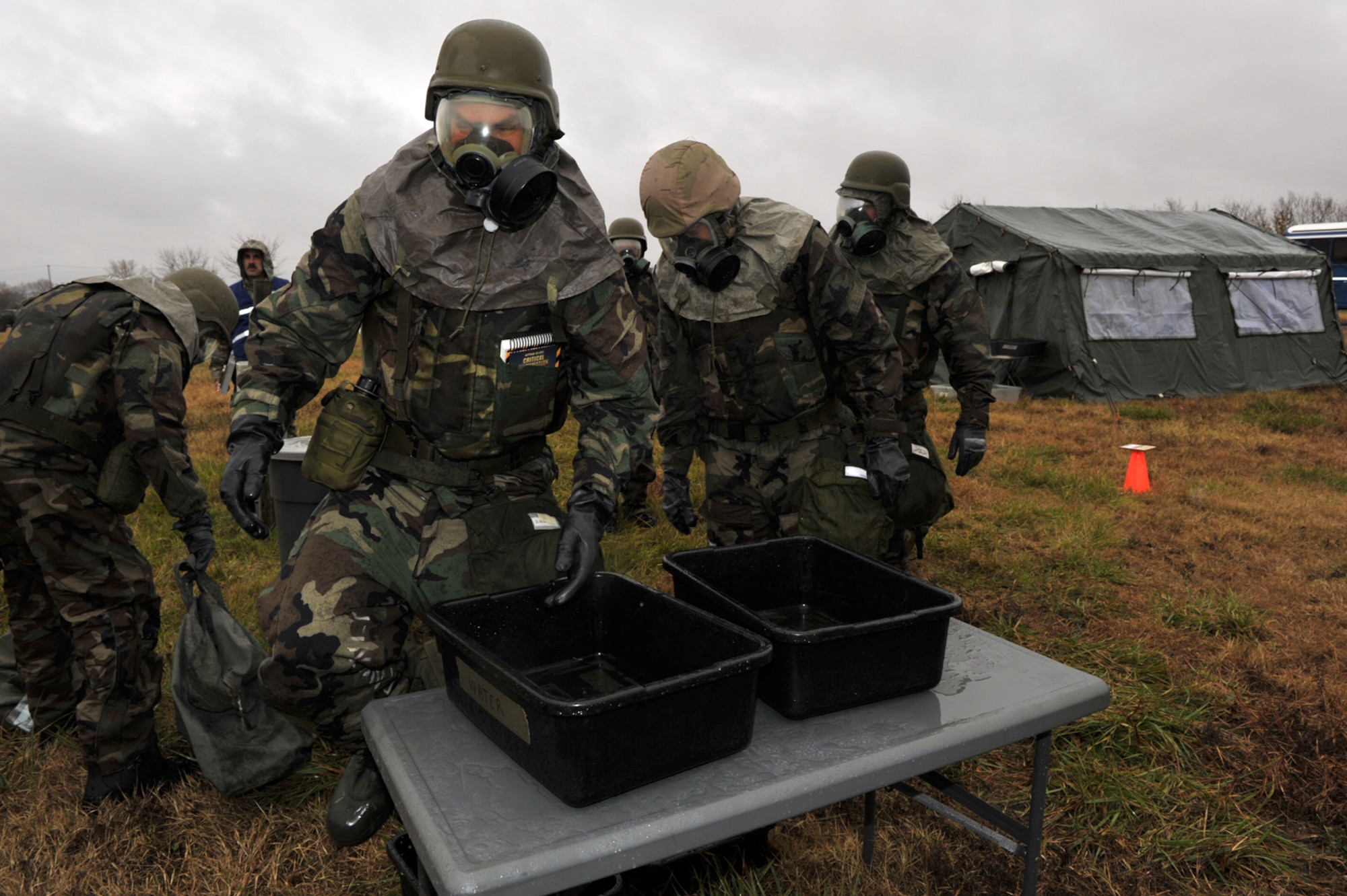 Capt. Scott Meyer finishes a glove washing simulation during a readiness inspection at McConnell Air Force Base, Kan., on Nov. 15. Captain Meyer is a Reserve KC-135 Stratotanker pilot assigned to the 18th Air Refueling Squadron, the flying unit of the 931st Air Refueling Group. (U.S. Air force photo/Master Sgt. Jason Schaap)