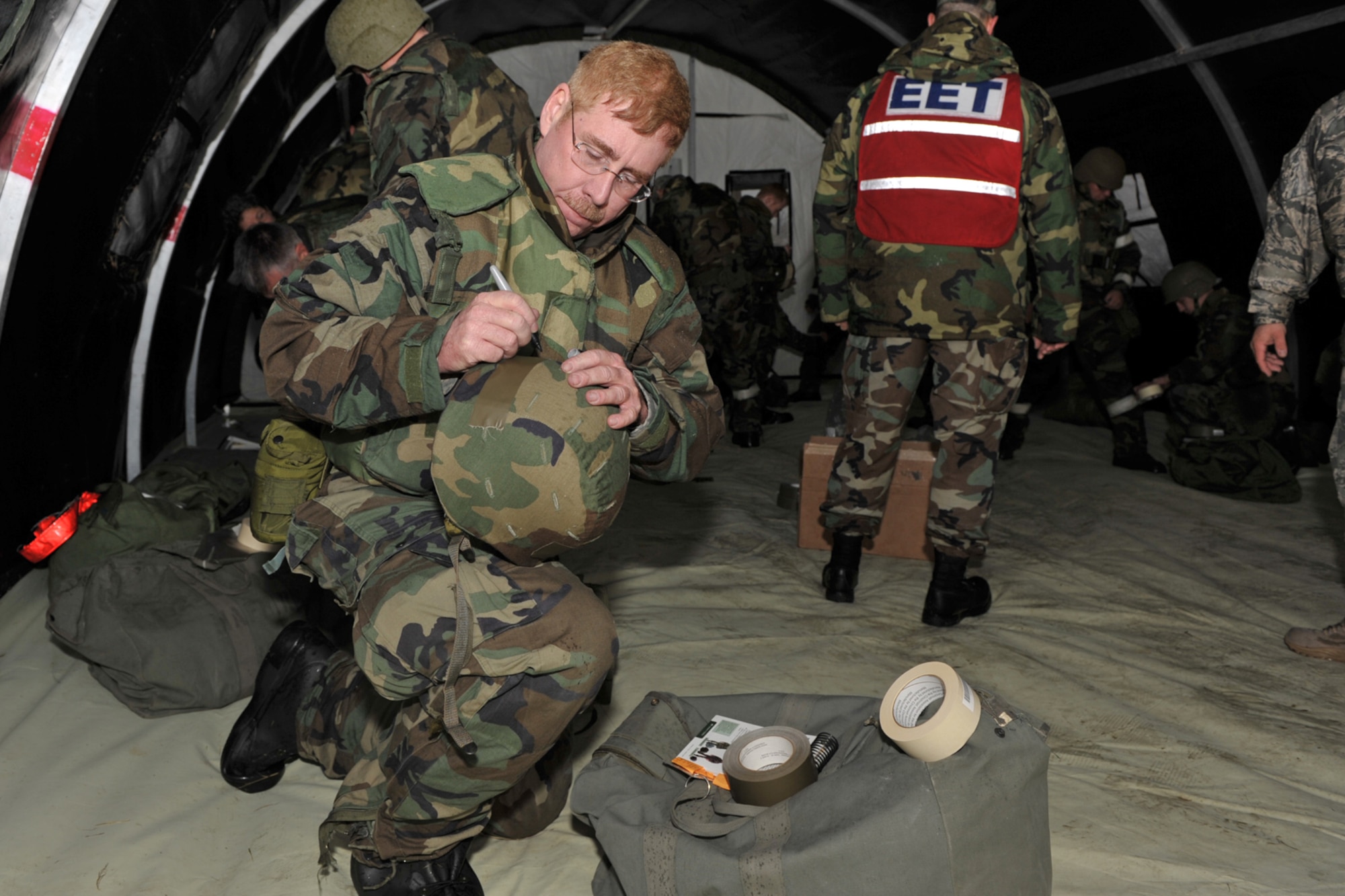 Chief Master Sgt. Dail Bruce marks his equipment during a readiness exercise at McConnell Air Force Base, Kan., on Nov. 15. Chief Bruce is assigned to the 931st Aircraft Maintenance Squadron, an Air Force Reserve unit at McConnell. (U.S. Air Force photo/Master Sgt. Jason Schaap)