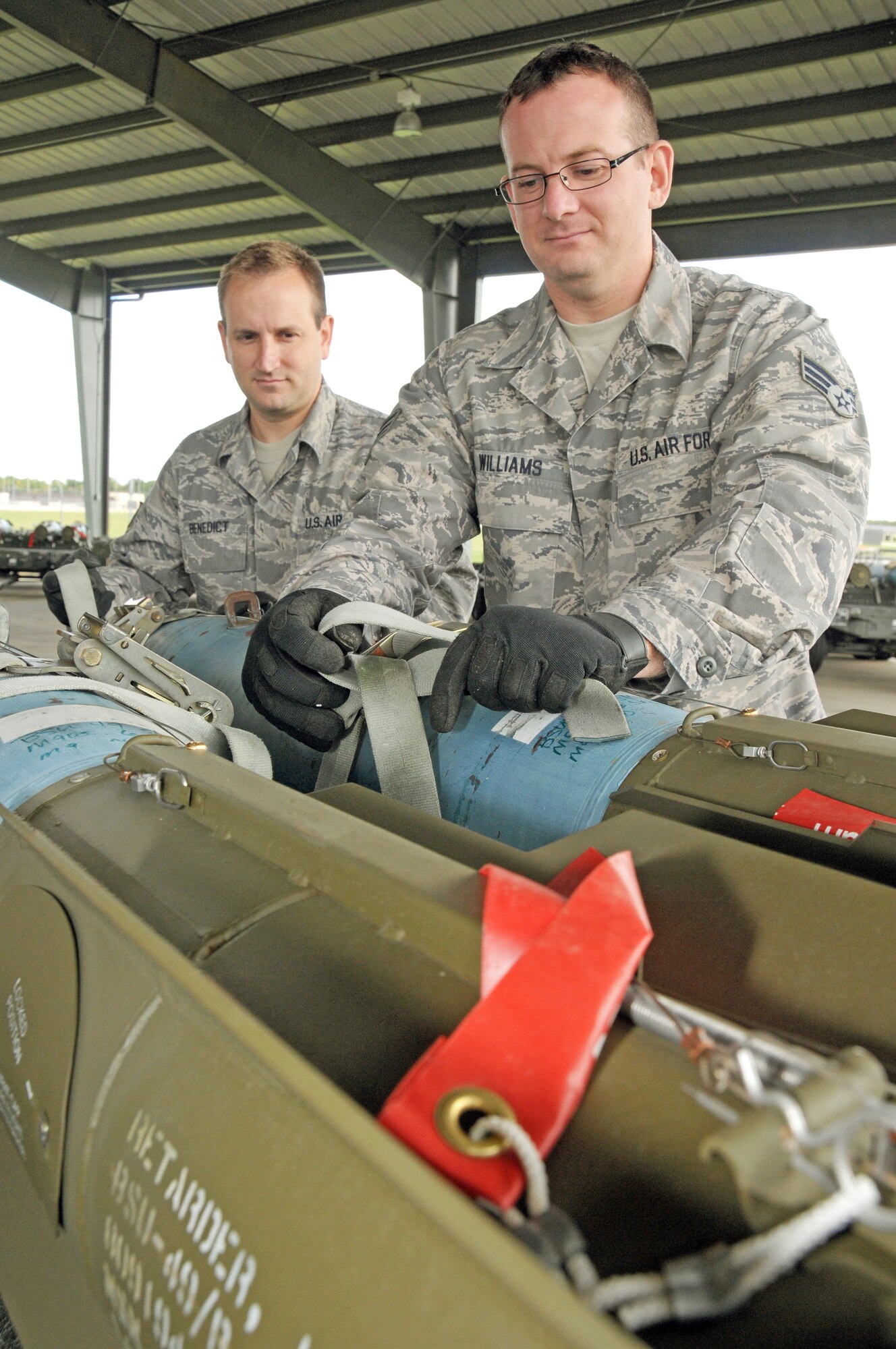 Senior Airman Pat Williams and Staff Sgt. Randy Benedict of the 442nd Maintenance Squadron wire an inert MK 82, 500-pound bomb, fused for air burst during the October 2009 unit training assembly. The 442nd Maintenance Squadron is part of the 442nd Fighter Wing, an Air Force Reserve unit at Whiteman Air Force Base, Mo.  (U.S. Air Force photo/Staff Sgt. Tom Talbert)