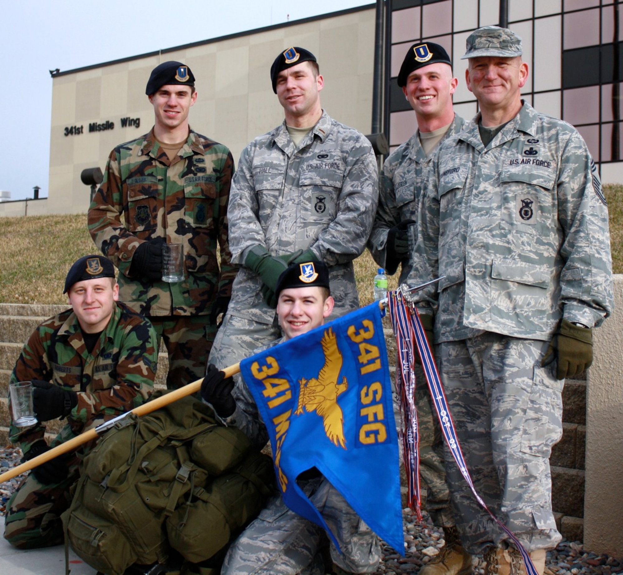 (top row, L to R) 2nd Lt. William Glojek, 2 Lt. Matthew Hall, 2 Lt. Stephen Zeglen, Chief Master Sgt. Charles Lunsford (bottom row, L to R) Airman 1st Class Jareth Roberts and Senior Airman Jamie Thompson were among the first to finish the 341st Security Forces Group's "Ruck Up and Remember" road march Nov.11, 2009.