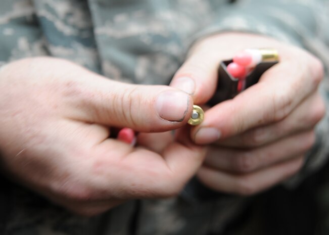 Tech. Sgt. Joshua Lucier loads simunition rounds into a magazine for a M-16 A2 at Charleston AFB Nov. 18. The M-16 A2 weapons were converted into simunition weapons for training purposes. Sergeant Lucier is a jet engine mechanic with the 437th Aircraft Maintenance Squadron. (U.S. Air Force photo/Senior Airman Katie Gieratz)(RELEASED)