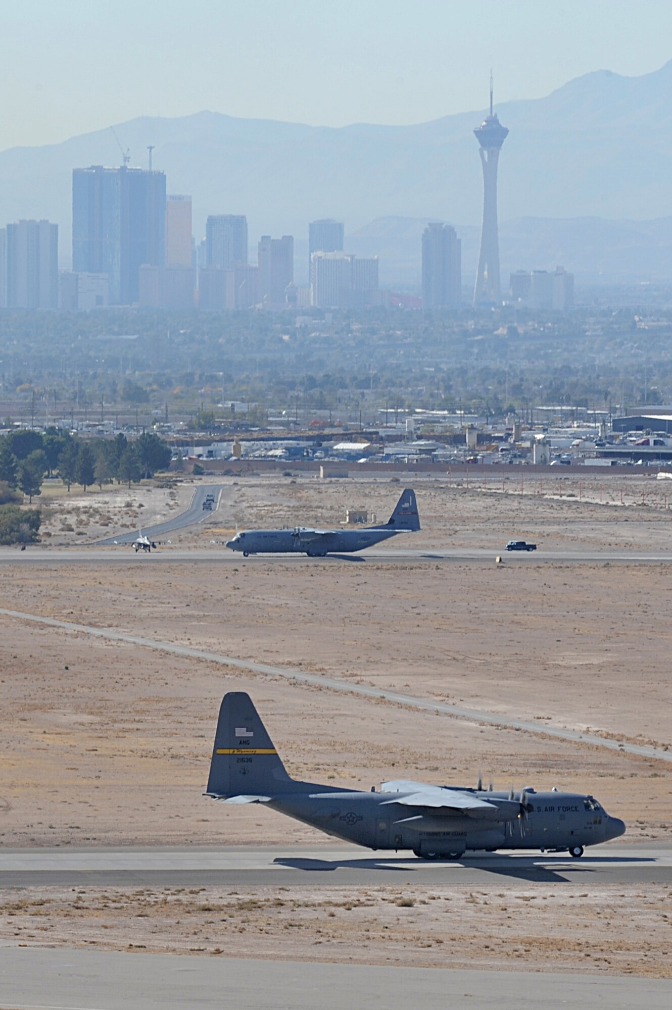 NELLIS AIR FORCE BASE, Nev.-- C-130 Hercules taxi during a Mobility Air Forces Exercise, Nov. 18. The aircraft are part of the bi-annual, U.S. Air Force Weapons School MAFEX which provides realistic training for combat air force, mobility air force, and U.S. Army personnel.  Approximately 40 C-17s and C-130s from Air Force bases around the United States flew approximately 400 Soldiers from Fort Bragg, N.C., for airdrops on the Nevada Test and Training Range. In addition to providing airdrop training, the exercise also allows Soldiers the opportunity to utilize Range facilities to conduct urban ground operations training.
(U.S. Air Force Photo / Airman 1st Class Stephanie Rubi) (RELEASED)