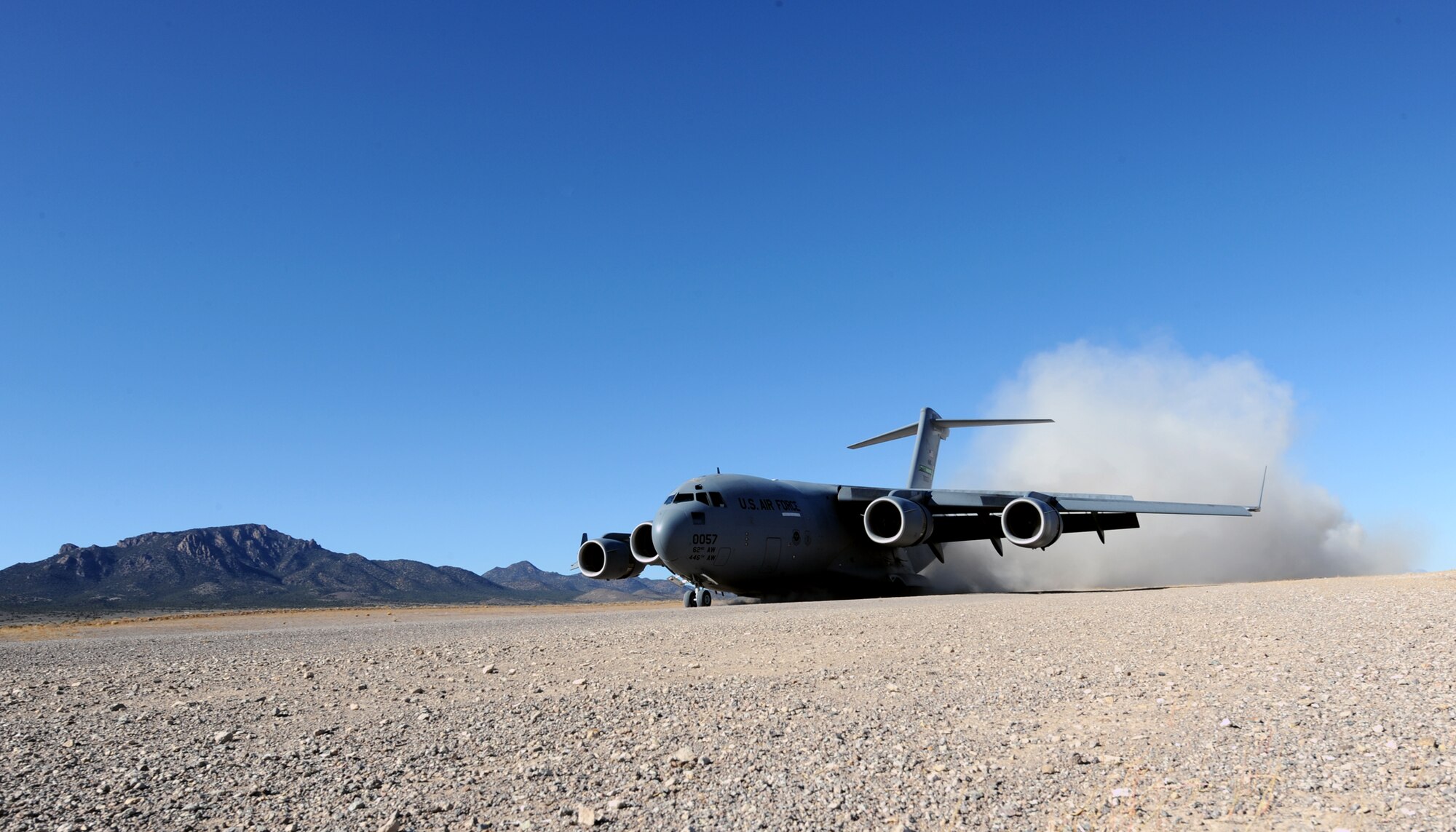 NEVADA TEST AND TRAINING RANGE -- A C-17 Globemaster III lands at Keno Airfield on the NTTR during the Mobility Air Forces Exercise, Nov. 18. The aircraft are part of the bi-annual, U.S. Air Force Weapons School MAFEX which provides realistic training for combat air force, mobility air force, and U.S. Army personnel.  Approximately 40 C-17s and C-130s from Air Force bases around the United States flew approximately 400 Soldiers from Fort Bragg, N.C., for airdrops on the Nevada Test and Training Range. In addition to providing airdrop training, the exercise also allows Soldiers the opportunity to utilize Range facilities to conduct urban ground operations training. (U.S. Air Force photo by Airman 1st Class Brett Clashman/Released)