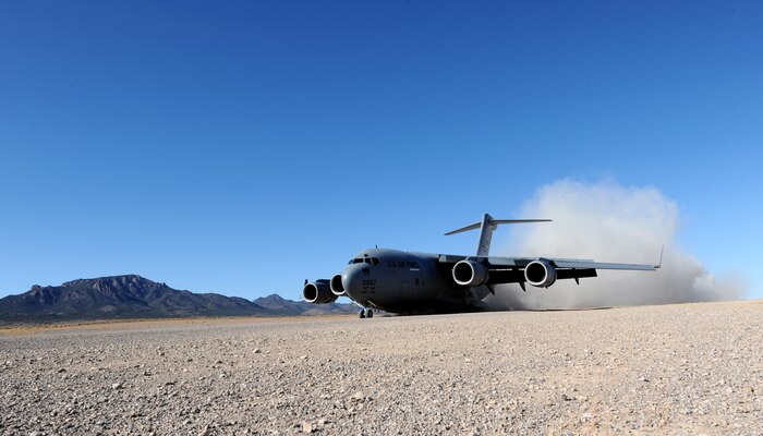 NEVADA TEST AND TRAINING RANGE -- A C-17 Globemaster III lands at Keno Airfield on the NTTR during the Mobility Air Forces Exercise, Nov. 18. The aircraft are part of the bi-annual, U.S. Air Force Weapons School MAFEX which provides realistic training for combat air force, mobility air force, and U.S. Army personnel.  Approximately 40 C-17s and C-130s from Air Force bases around the United States flew approximately 400 Soldiers from Fort Bragg, N.C., for airdrops on the Nevada Test and Training Range. In addition to providing airdrop training, the exercise also allows Soldiers the opportunity to utilize Range facilities to conduct urban ground operations training. (U.S. Air Force photo by Airman 1st Class Brett Clashman/Released)