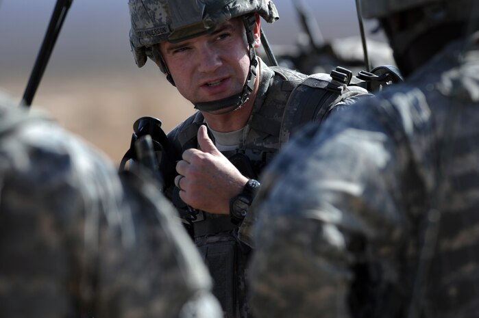 NEVADA TEST AND TRAINING RANGE -- 
Capt. Michael Anderson 173 Calvary Airborne Reconnaissance Squadron, Bravo Troop commander, gives instruction to his squad leaders before moving to the Urban Operations Complex on the NTTR. The Soldiers from the 173rd were airdropped into the NTTR by U.S. Air Force C-17s and C-130s.  The soldiers and aircraft are part of the bi-annual, U.S. Air Force Weapons School Mobility Air Forces Exercise which provides realistic training for combat air force, mobility air force, and U.S. Army personnel.  Approximately 40 C-17s and C-130s from Air Force bases around the United States flew approximately 400 Soldiers from Fort Bragg, N.C., for airdrops on the Nevada Test and Training Range. In addition to providing airdrop training, the exercise also allows Soldiers the opportunity to utilize Range facilities to conduct urban ground operations training.
(U.S. Air Force photo by Tech. Sgt. Michael R. Holzworth)(released)