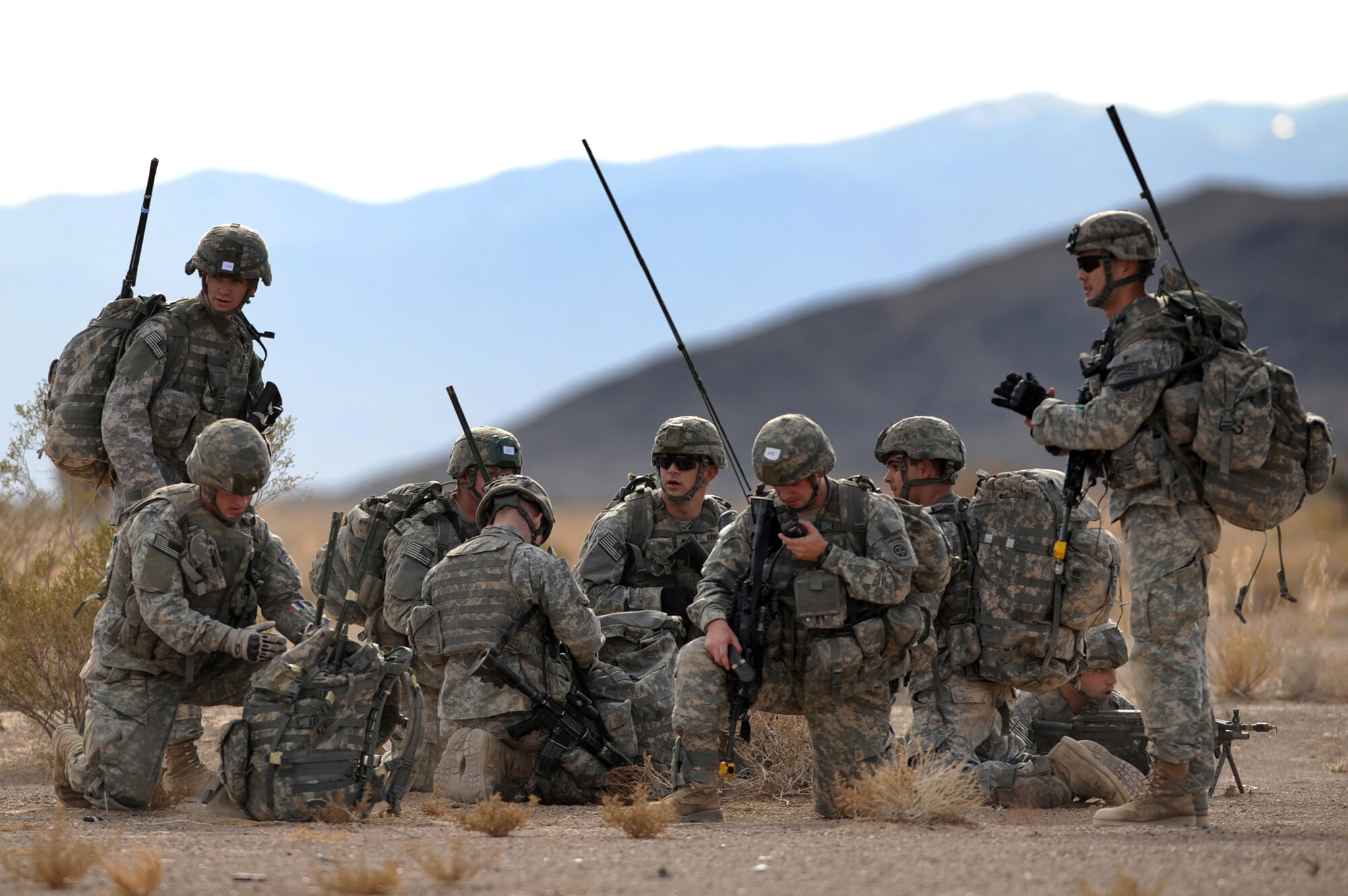 NEVADA TEST AND TRAINING RANGE -- 
Soldiers from 173 Calvary Airborne Reconnaissance Squadron, Fort Bragg, N.C., meet at the rally point after being airdropped into the Urban Operations Complex in the NTTR by U.S. Air Force C-17s and C-130s.  The soldiers are part of the bi-annual, U.S. Air Force Weapons School Mobility Air Forces Exercise which provides realistic training for combat air force, mobility air force, and U.S. Army personnel.  Approximately 40 C-17s and C-130s from Air Force bases around the United States flew approximately 400 Soldiers from Fort Bragg, N.C., for airdrops on the Nevada Test and Training Range. In addition to providing airdrop training, the exercise also allows Soldiers the opportunity to utilize Range facilities to conduct urban ground operations training.
(U.S. Air Force photo by Tech. Sgt. Michael R. Holzworth)(released)