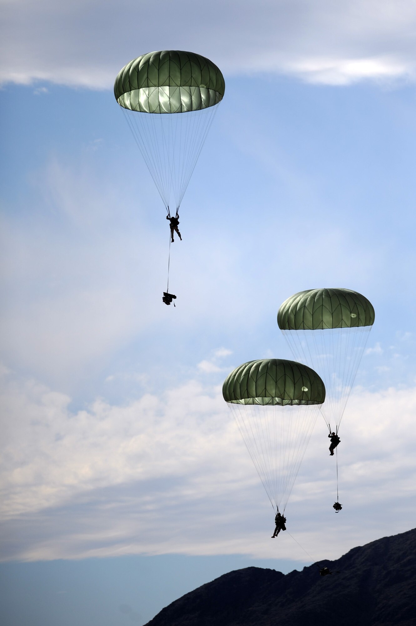 NEVADA TEST AND TRAINING RANGE --
Soldiers from the 173 Calvary Airborne Reconnaissance Squadron parachute on to the NTTR during a Mobility Air Forces Exercise, Nov. 18. The aircraft are part of the bi-annual U.S. Air Force Weapons School MAFEX which provides realistic training for combat air force, mobility air force, and U.S. Army personnel.  Approximately 40 C-17s and C-130s from Air Force bases around the United States flew approximately 400 Soldiers from Fort Bragg, N.C., for airdrops on the Nevada Test and Training Range. In addition to providing airdrop training, the exercise also allows Soldiers the opportunity to utilize Range facilities to conduct urban ground operations training.
(U.S. Air Force photo by Tech. Sgt. Michael R. Holzworth)(Released)