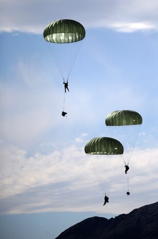 NEVADA TEST AND TRAINING RANGE --Soldiers from the 173 Calvary Airborne Reconnaissance Squadron parachute on to the NTTR during a Mobility Air Forces Exercise, Nov. 18. The aircraft are part of the bi-annual U.S. Air Force Weapons School MAFEX which provides realistic training for combat air force, mobility air force, and U.S. Army personnel.  Approximately 40 C-17s and C-130s from Air Force bases around the United States flew approximately 400 Soldiers from Fort Bragg, N.C., for airdrops on the Nevada Test and Training Range. In addition to providing airdrop training, the exercise also allows Soldiers the opportunity to utilize Range facilities to conduct urban ground operations training.(U.S. Air Force photo by Tech. Sgt. Michael R. Holzworth)(Released)