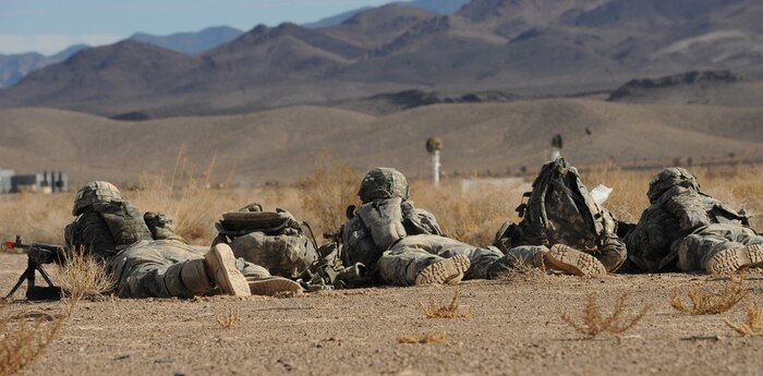 NEVADA TEST AND TRAINING RANGE--Soldiers from 173 Calvary Airborne Reconnaissance Squadron, Fort Bragg, N.C., set up a perimeter during a Mobility Air Forces Exercise, Nov. 18. The aircraft are part of the bi-annual U.S. Air Force Weapons School MAFEX which provides realistic training for combat air force, mobility air force, and U.S. Army personnel.  Approximately 40 C-17s and C-130s from Air Force bases around the United States flew approximately 400 Soldiers from Fort Bragg, N.C., for airdrops on the Nevada Test and Training Range. In addition to providing airdrop training, the exercise also allows Soldiers the opportunity to utilize Range facilities to conduct urban ground operations training.(U.S. Air Force Photo / Airman 1st Class Jamie Nicley)