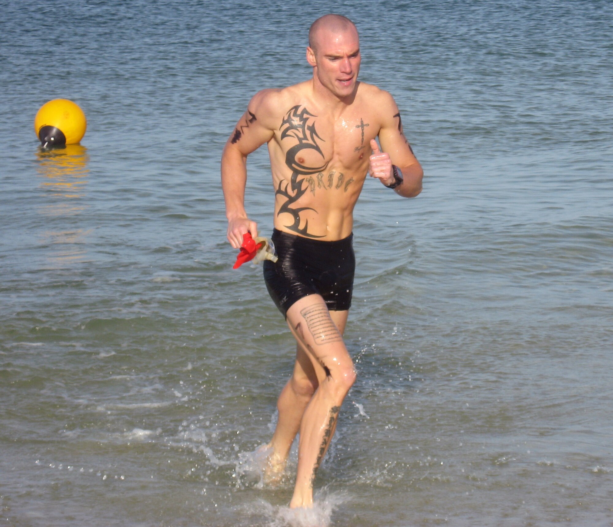 Staff Sgt. Nathan Spradely, NCO in charge of confinement, 325th Security Forces Squadron, competes in Beach Blast Triathalon at Mexico Beach, Fla. (U.S. Air Force courtesy photo)