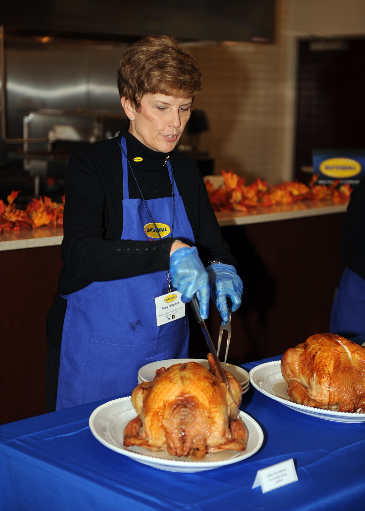 Mary Clingman, director of Butterball's Turkey-Talk Line, carves a turkey at the Butterball headquarters in Garner, N.C., Nov. 17, 2009. The Turkey-Talk Line is a hotline people can call for tips on how to prepare and cook turkeys. Mrs. Clingman, who is from Chicago, has been with the talk line for 28 years. (U.S. Air Force photo/Senior Airman Ciara Wymbs) 