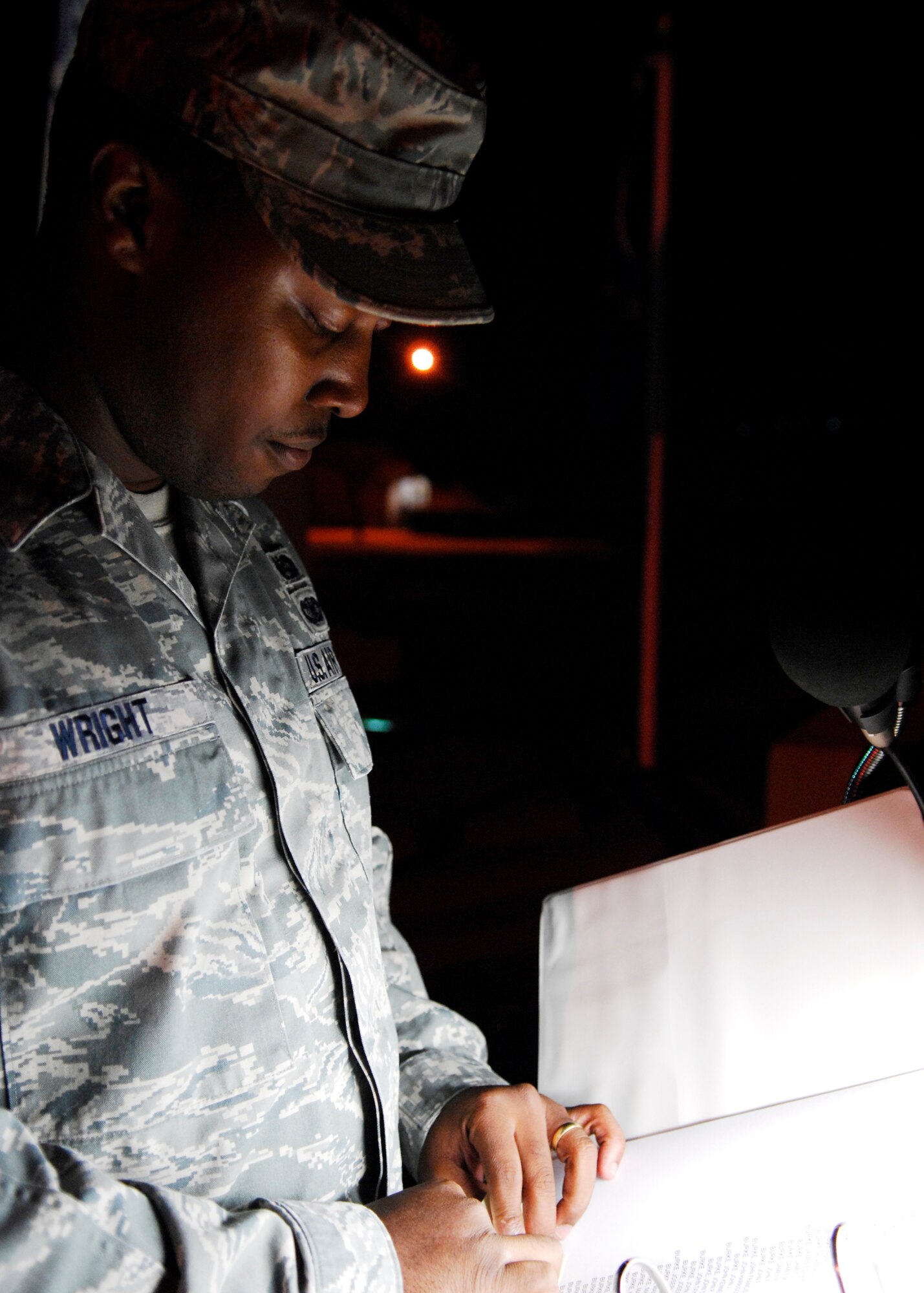 VANDENBERG AIR FORCE BASE, Calif. -- As day turns into night, Staff Sgt. Steven Wright, a paralegal for the 30th Space Wing Judge Advocate Office, continues reading from the list of more than 92,000 servicemembers who were prisoners of war or missing in action here Friday, Nov. 13, 2009. A 24-hour vigil followed by a closing ceremony was held to remember those servicemembers. (U.S. Air Force photo/Airman 1st Class Heather R. Shaw)









