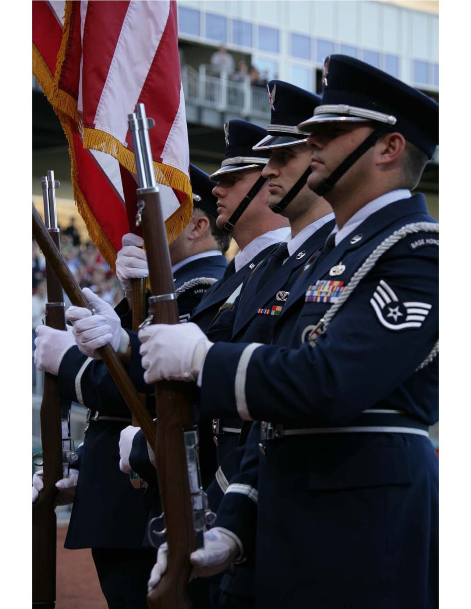 Tech Sgt. Cory McCain, Senior Master Sgt. Jimmy Hudlow, Tech Sgt. Travis Black and Staff Sgt. Jeff Beard, all members of the 188th Fighter Wing Honor Guard, post the colors at the Northwest Arkansas Naturals' (Kansas City Royals' AA minor league affiliate) inaugural season home opener at Arvest Ballpark in Springdale, Ark., April 10, 2008. All four 188th members also deployed in support of Operation Iraqi Freedom. (U.S. Air Force photo by 188th Fighter Wing Public Affairs)