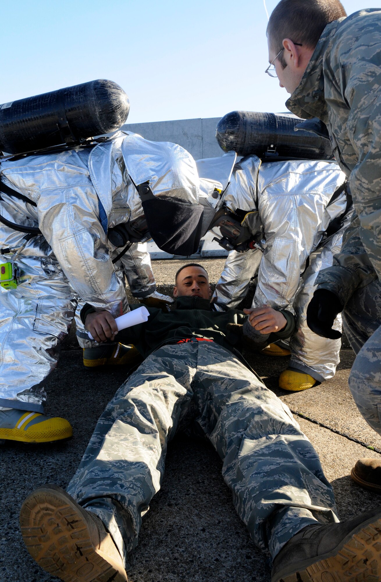 SPANGDAHLEM AIR BASE, Germany – Firefighters from the 52nd Civil Engineer Squadron simulate treatment on Airman 1st Class Jarryd Hopkins, 52nd Aircraft Maintenance Squadron, during a hydrazine response exercise Nov. 19. Hydrazine fuels the emergency power unit of an F-16 Fighting Falcon in the event the aircraft loses hydraulic, electrical or engine power in flight. (U.S. Air Force photo/Airman 1st Class Staci Miller)