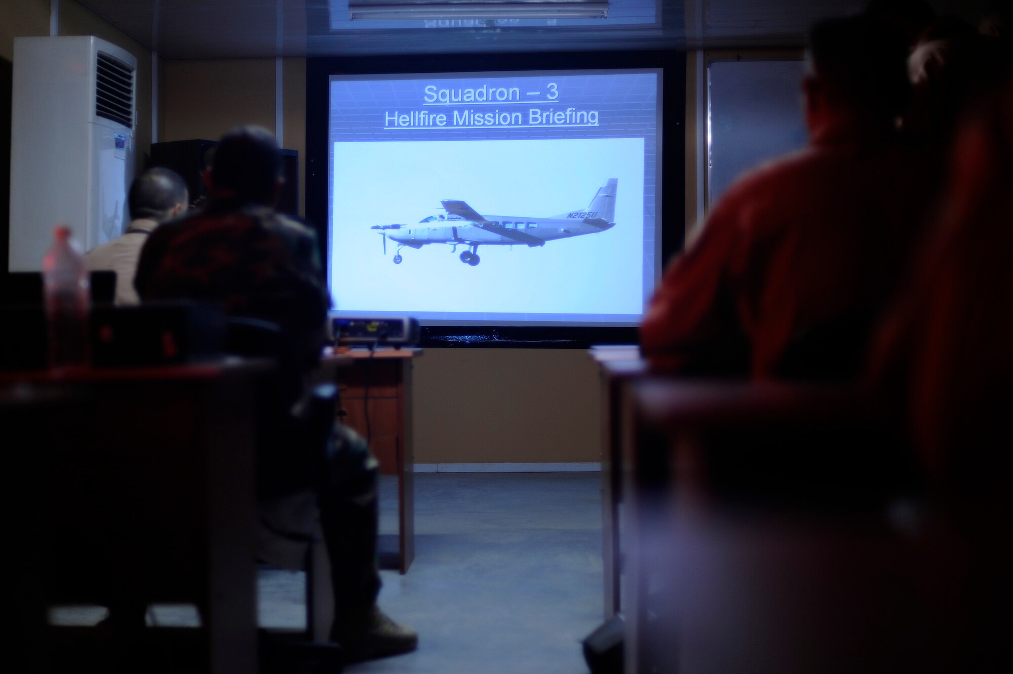 An Iraqi Air Force AC-208B Combat Caravan crew from Squadron 3 at Kirkuk Air Base, Iraq, conducts a mission briefing prior to a training mission, Oct. 27, 2009.  This Iraqi crew is preparing for the first AGM-114 Hellfire missile launch since the re-formation of its air force on Nov. 4.  (U.S. Air Force photo by Staff Sgt. Michael B. Keller) (Released)

