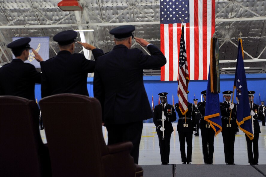 Maj. Gen, Darrell E. Jones, Lt. Gen. Ralph Jodice and Gen. Howie Chandler salute the colors during the AFDW change of Command ceremony. General Jones took command of the Air Force District of Washington on Nov. 18, 2009. The Air Force Honor Guard is holding the three flags. The guard was on hand for an official troop inspection by both the incoming and outgoing commanders. 