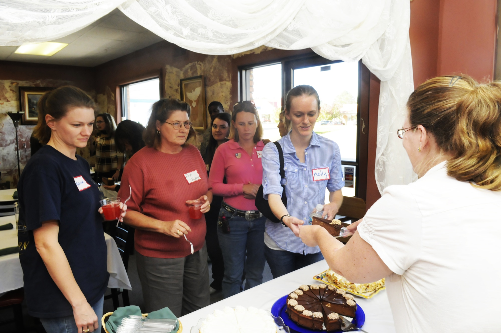Members of the tour group tasted samples at Lane Packing in Fort Valley. U. S. Air Force photo by Sue Sapp