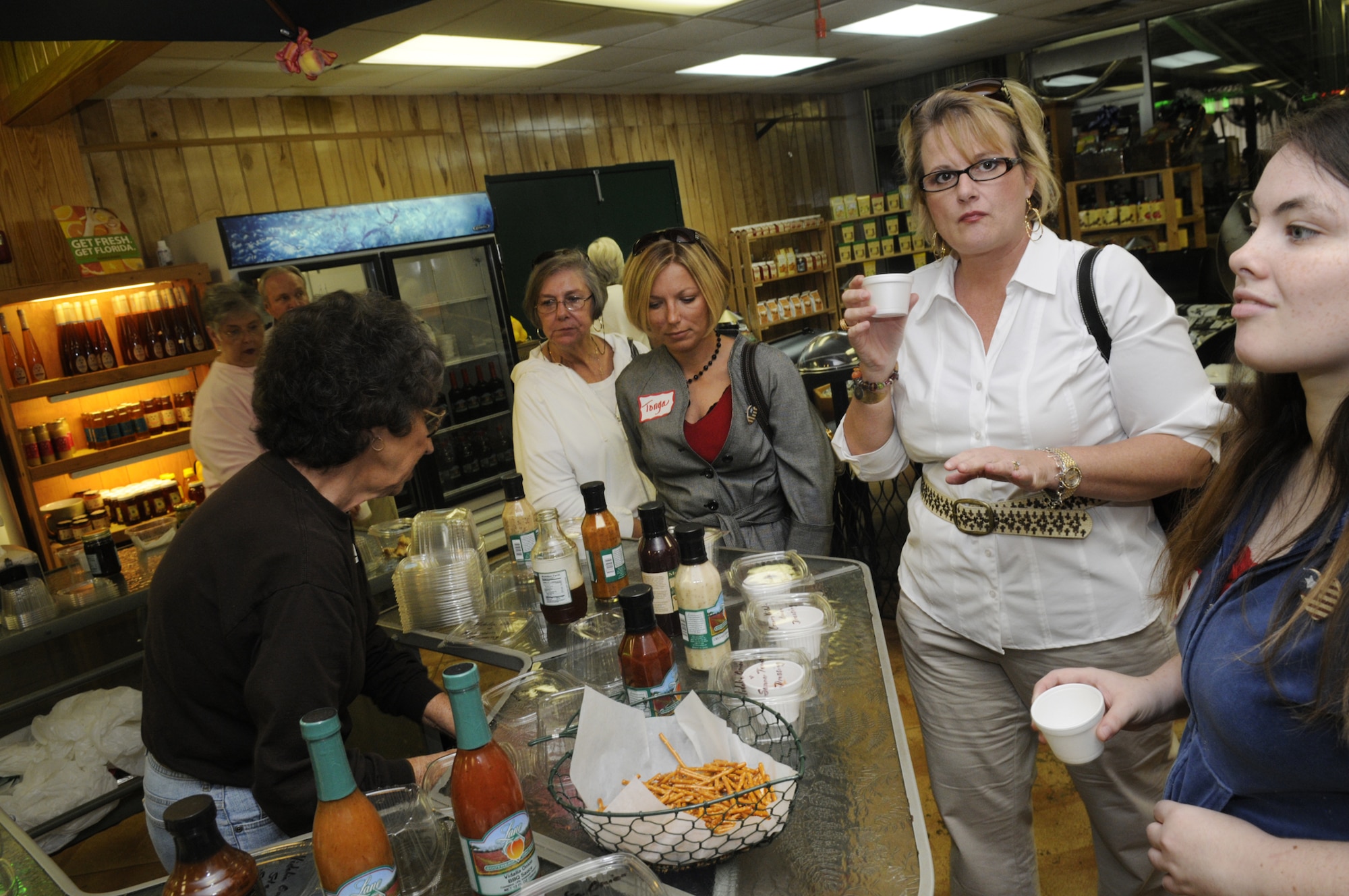 Members of the tour group tasted samples at Lane Packing in Fort Valley. U. S. Air Force photo by Sue Sapp