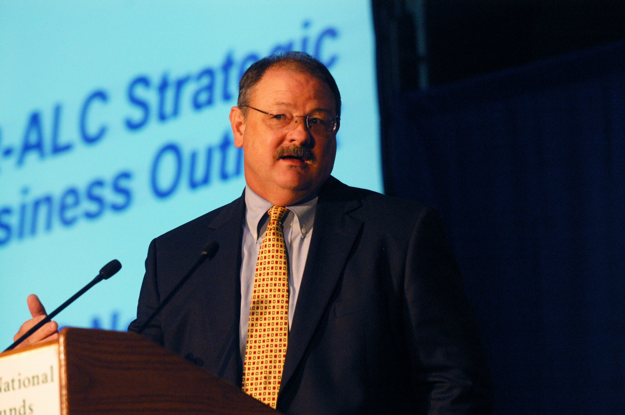 Deryl Israel, Warner Robins Air Logistics Center executive director, gives a briefing at the Requirements Symposium Nov. 18. U. S. Air Force photo by Sue Sapp      