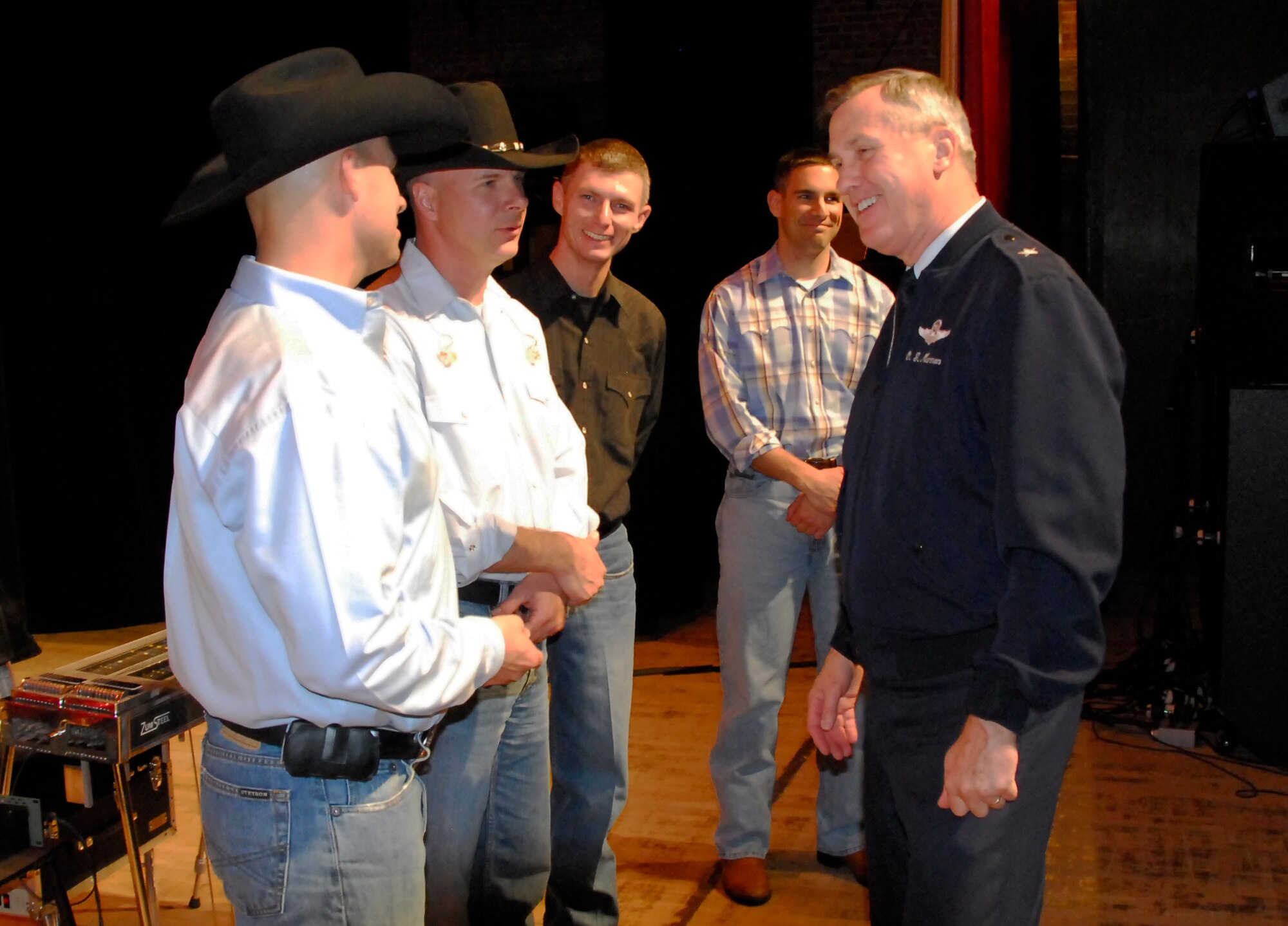 Brig. Gen. O.G. Mannon, 82nd Training Wing commander, compliments members of Wild Blue Country after their performance at the Memorial Auditorium Nov. 17 in Wichita Falls, Texas. WBC is an Air Force Academy Band that performs all over the nation. (U.S. Air Force photo/ Harry Tonemah)