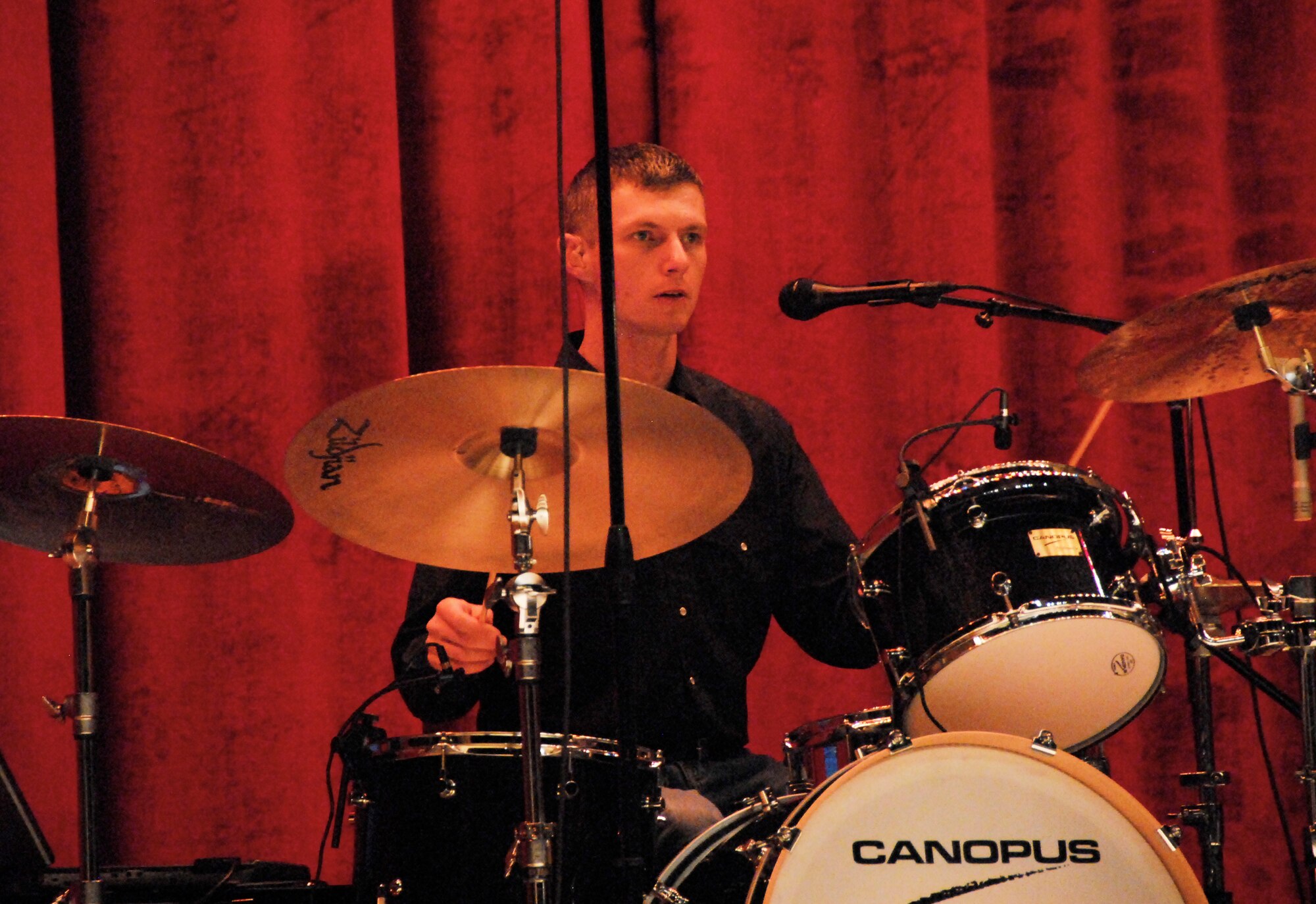 Tech. Sgt. Timothy Stombaugh, the Wild Blue Country drummer, performs at the Memorial Auditorium Nov. 17 in Wichita Falls, Texas.  WBC is an Air Force Academy Band that performs all over the nation. (U.S. Air Force photo/ Harry Tonemah)
