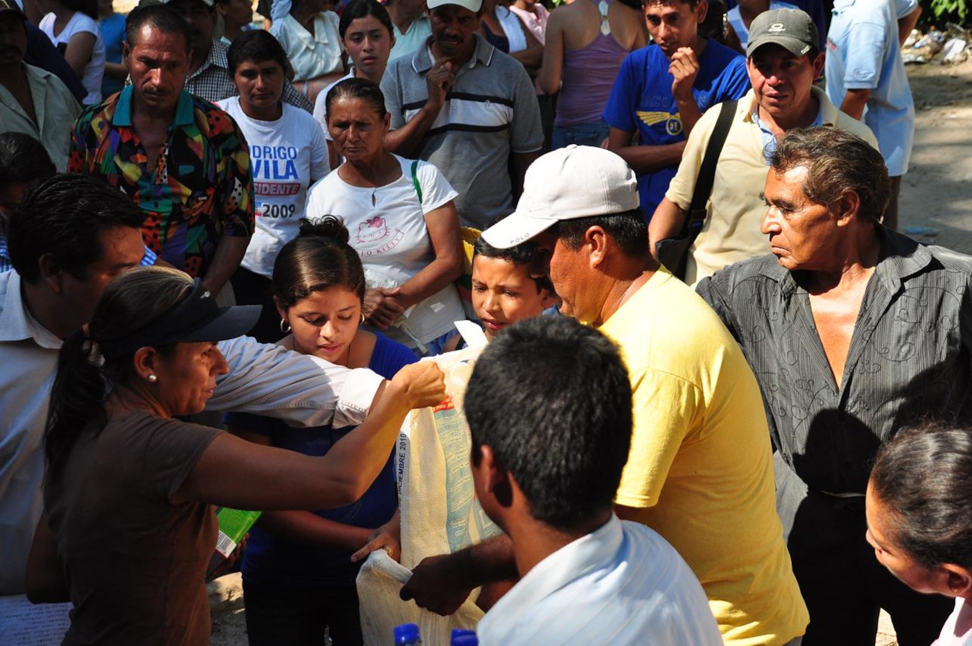 ILOPANGO, El Salvador - Community leaders distribute food and water to the villagers of El Sauce, El Salvador Nov. 17. A Civil Affairs team from Special Operations Command South, based out of Homestead, Florida, provided vital aid to the small village of El Sauce by dropping off more than 5,000 total pounds of food and water Nov. 17 and 18. The area was so badly damaged by the floods that villagers had to hand-carry the 5,000 pounds of food and water almost a quarter of a mile back to the village (U.S. Air Force photo/Staff Sgt. Chad Thompson).