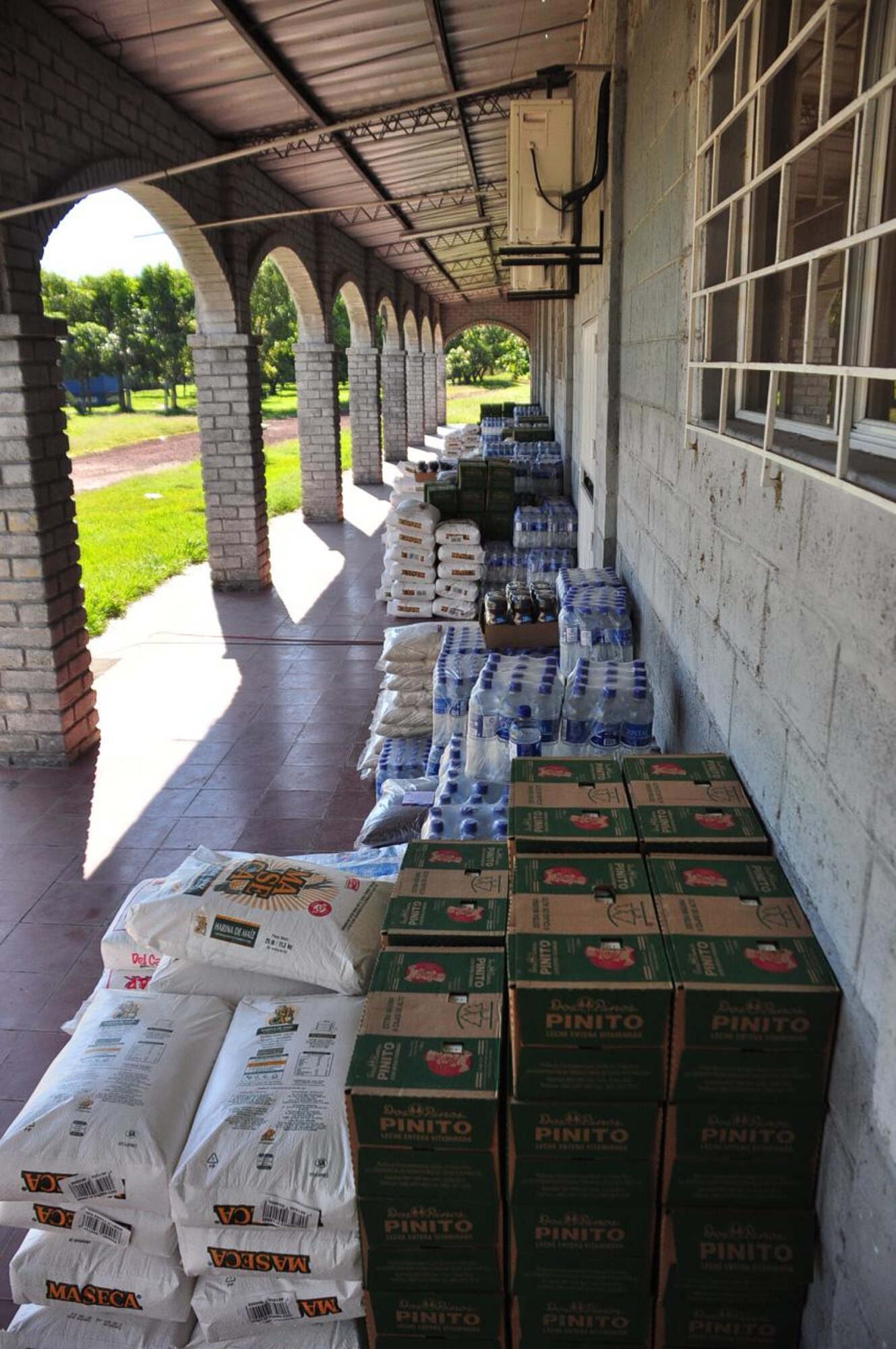 ILOPANGO, El Salvador - Thousands of pounds of food and water sits and waits to be distributed to the small town of El Sauce Nov. 17 near Ilopango International Airport. A Civil Affairs team from Special Operations Command South, based out of Homestead, Florida, provided vital aid to the small village of El Sauce by dropping off more than 5,000 total pounds of food and water Nov. 17 and 18. This has been a combined effort by Salvadoran government and military, the people of El Sauce, the U.S. Agency for International Development, or USAID, Civil Affairs and Joint Task Force-Bravo (U.S. Air Force photo/Staff Sgt. Chad Thompson).