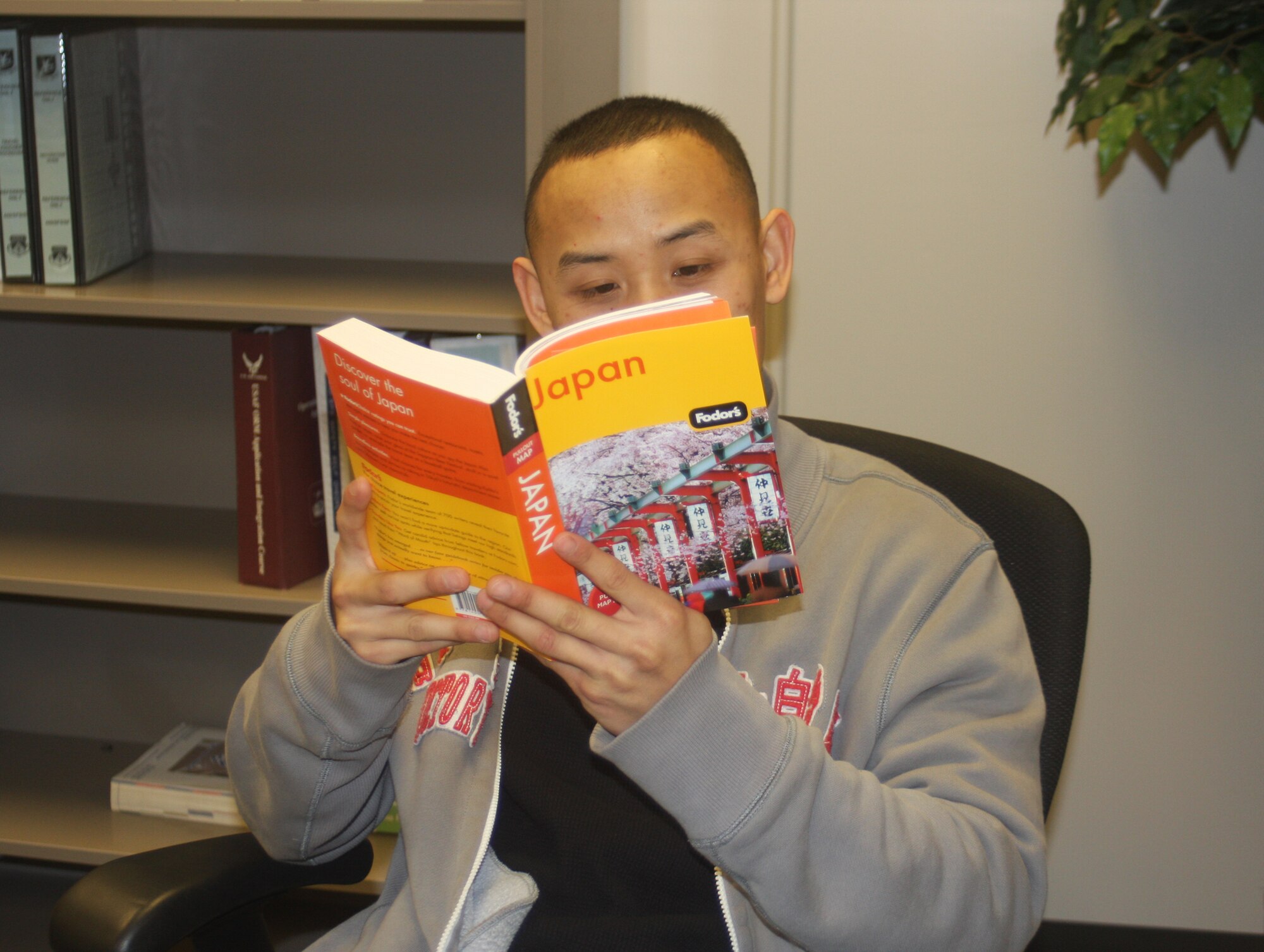 WRIGHT-PATTERSON AIR FORCE BASE, Ohio - Staff Sgt. Mouk Chounlamany, 445th Security Forces Squadron, studies Japanese culture while waiting to depart for Japan.  Sergeant Chounlamany and 10 other SFS reservists volunteered to spend up to 180 days in Japan to back fill their active duty counterparts who are deploying from both Yokota and Kadena Air Bases in Japan to Southwest Asia. (U.S. Air Force photo/Stacy Vaughn) 