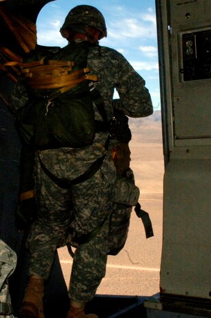 A Soldier with the 82nd Airborne Division out of Fort Bragg, N.C., prepares to jump out of a Charleston C-17 during the Mobility Air Forces Exercise Nov. 18. More than 40 mobility aircraft and 400 soldiers from the 82 AD participated in the exercise to provide realistic training for mobility air forces and Army partners for both ongoing operations and future contingencies. (U.S. Air Force photo/Staff Sgt. Marie Brown)