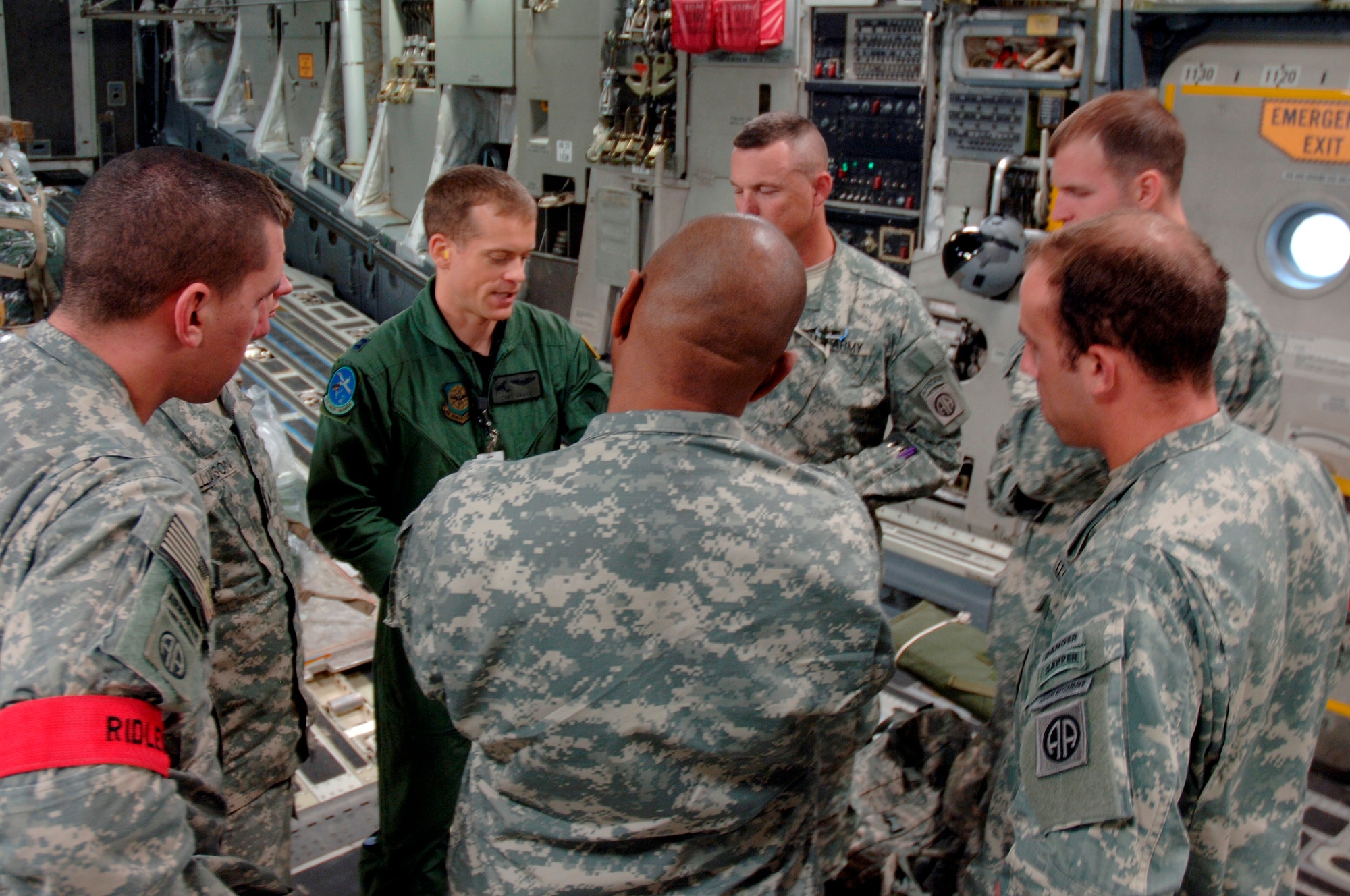 Capt. Curt Haase gives a preflight briefing at Pope AFB, N.C., to a team of jumpmasters with the 82nd Airborne Division out of Fort Bragg, N.C., aboard a Charleston C-17 in preparation for an aerial jump during the Mobility Air Forces Exercise Nov. 18. The 82nd Airborne Division participated in the exercise, bringing the realism of a combat operation for the Charleston AFB aircrew responsible for their safe, on-time arrival to their Nevada dropzone. Captain Haase was the aircraft commander for the mission and is assigned to the 14th Airlift Squadron. (U.S. Air Force photo/Staff Sgt. Marie Brown)