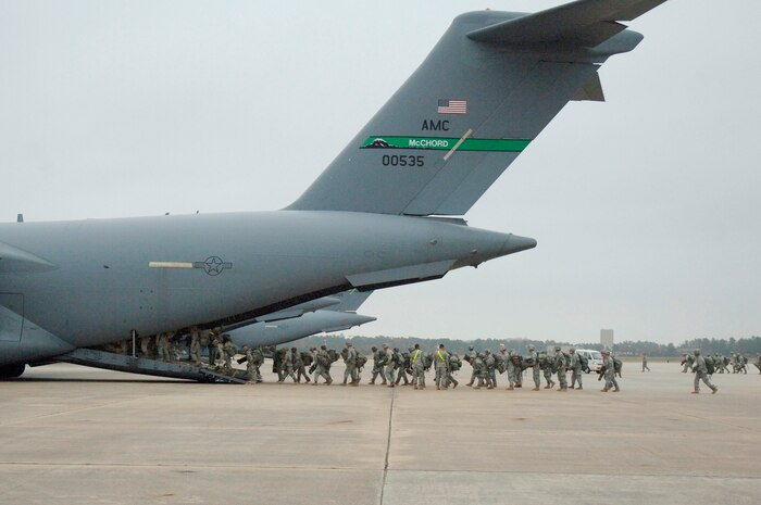 Soldiers with the 82nd Airborne Division out of Fort Bragg, N.C., board a C-17 from McChord AFB, Wash., at Pope AFB, N.C., in preparation for an aerial jump in support of the Mobility Air Forces Exercise Nov. 18. More than 1,500 people participated in MAFEX, executing a Joint Forcible Entry Airborne Assault through precision airdrop operations by integrating a variety of Air Force mobility assets from across the U.S. (U.S. Air Force photo/Staff Sgt. Marie Brown)