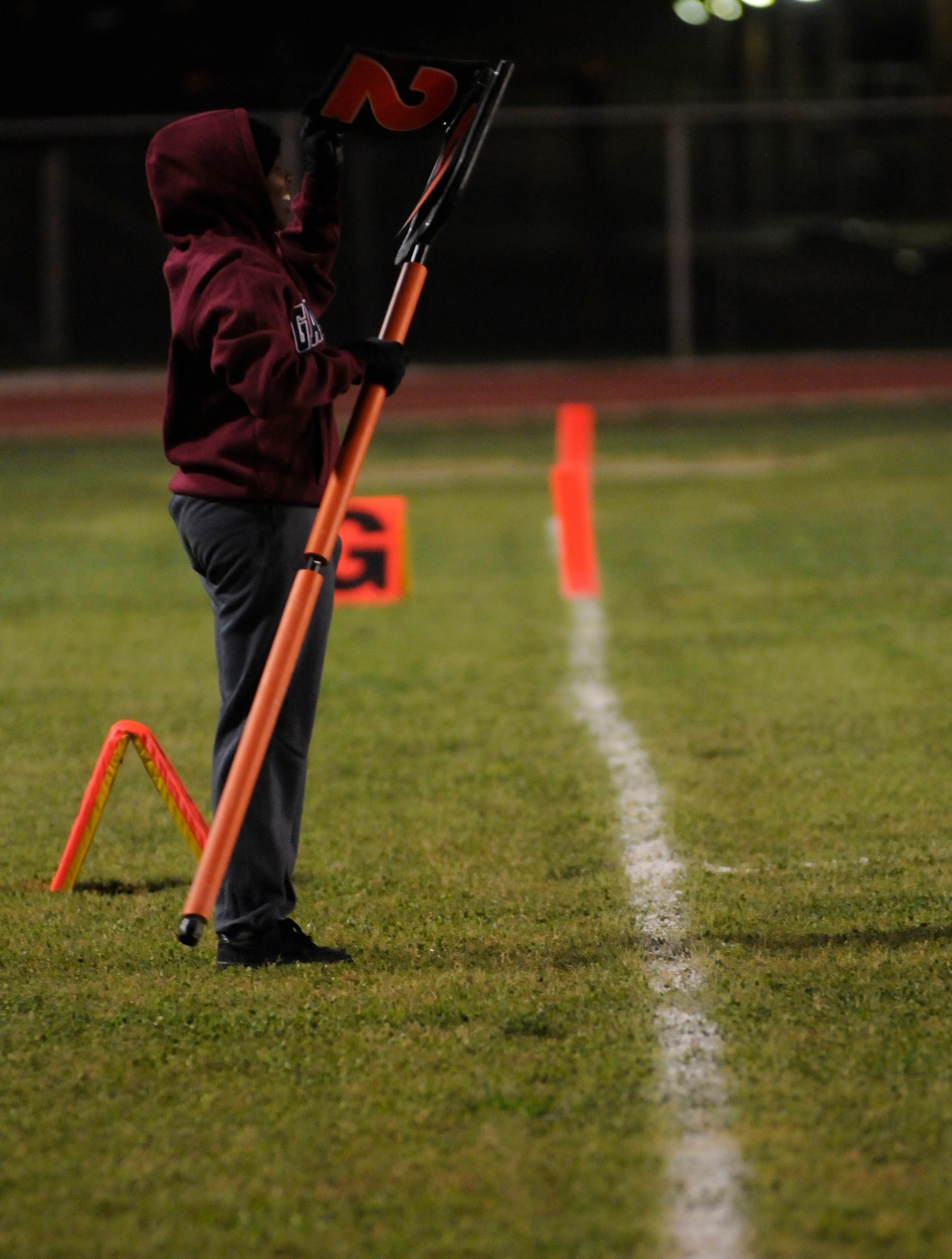Staff Sgt. Ardrea Wilson, 39th Medical Support Squadron, lets the players know they are on second down during the championship intramural flag football game at the Incirlik football field, Tuesday, Nov. 17, 2009. The 39th SFS won the first game 25 to 0 tying the 728th AMS for the intramural title. A second game was played to decide the winner of the commander’s plaque. 39th SFS won the second game 31 to 12 to secure the title. (U.S. Air Force photo/Airman 1st Class Amber Ashcraft)
