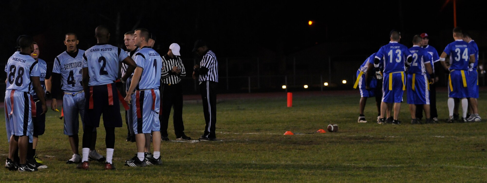 The 728th Air Mobility Squadron and 39th Security Forces Squadron teams huddle up before the beginning of the second half during the championship intramural flag football game at the Incirlik football field, Tuesday, Nov. 17, 2009. The 39th SFS won the first game 25 to 0 tying the 728th AMS for the intramural title. A second game was played to decide the winner of the commander’s plaque. 39th SFS won the second game 31 to 12 to secure the title. (U.S. Air Force photo/Airman 1st Class Amber Ashcraft)