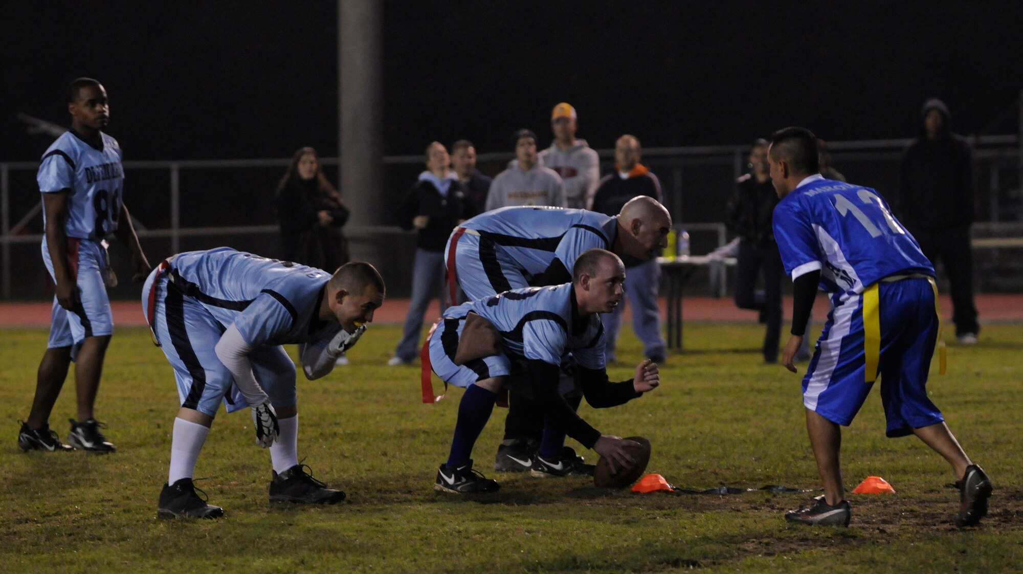 The 39th Security Forces Squadron quarterback anticipates the snap during the championship intramural flag football game at the Incirlik football field, Tuesday, Nov. 17, 2009. The 39th SFS won the first game 25 to 0 tying the 728th AMS for the intramural title. A second game was played to decide the winner of the commander’s plaque. 39th SFS won the second game 31 to 12 to secure the title. (U.S. Air Force photo/Airman 1st Class Amber Ashcraft)