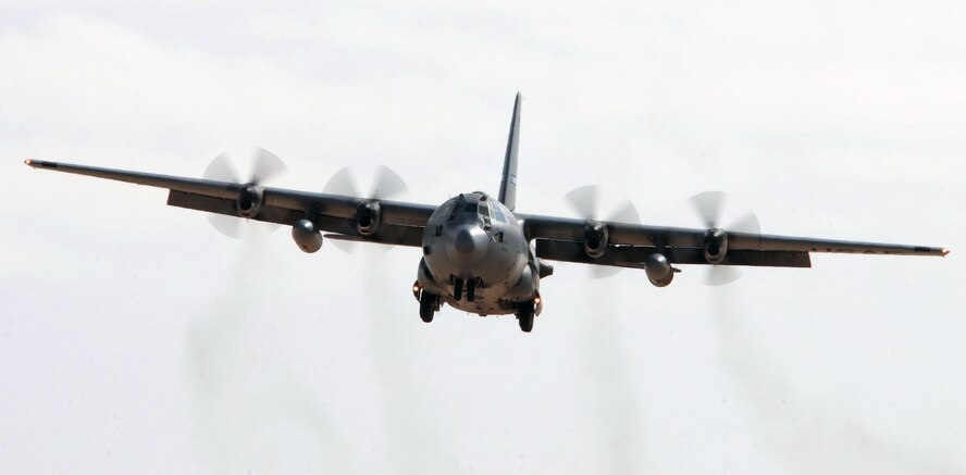 SOUTHWEST ASIA -- A 737th Expeditionary Airlift Squadron C-130 Hercules prepares for landing at an air base in Southwest Asia Nov. 18, 2009.  The C-130 is deployed from the 317th Airlift Group, Dyess Air Force Base, Texas.  (U.S. Air Force photo/Tech. Sgt. Tony Tolley)