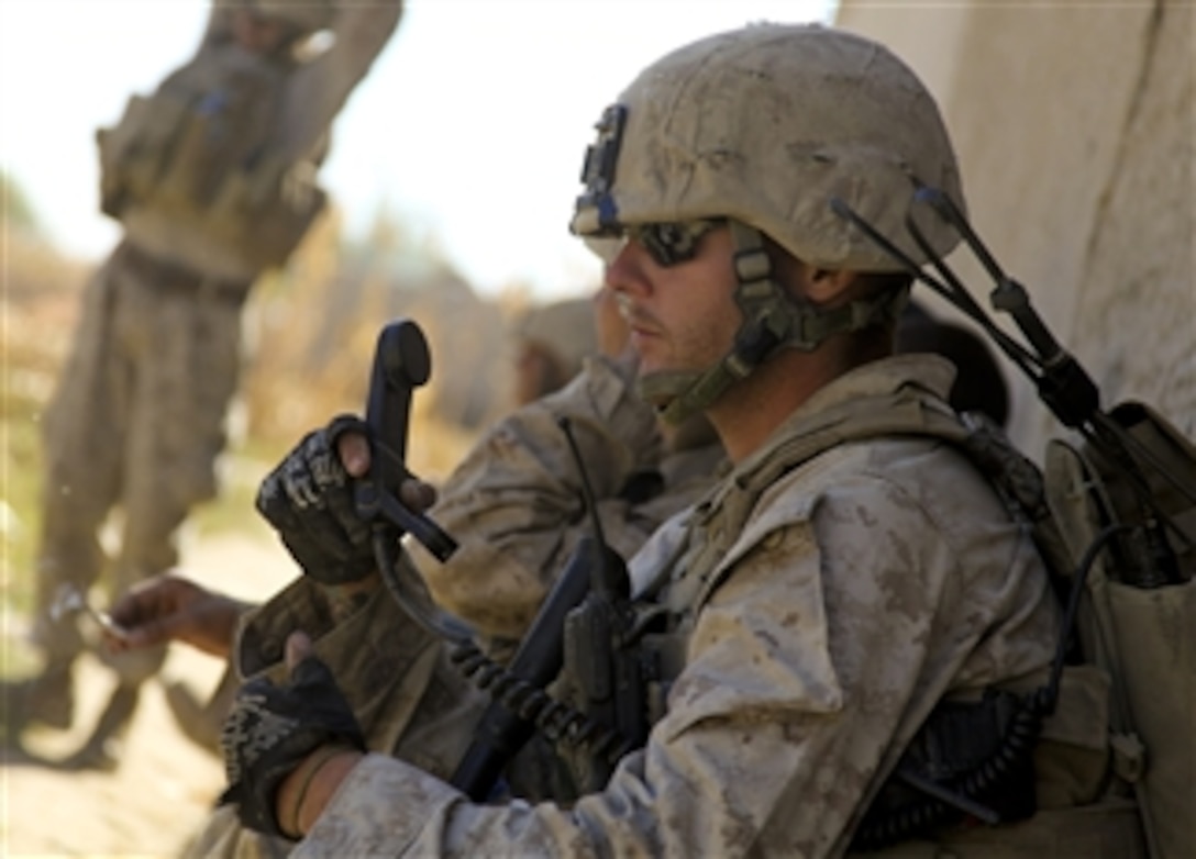 U.S. Marine Corps Sgt. Sean Cain, with Charlie Company, 1st Battalion, 5th Marine Regiment, performs a radio check during a security patrol in the Nawa district of the Helmand province, Afghanistan, on Nov. 9, 2009.  The 1st Battalion, 5th Marine Regiment is a ground combat element deployed with Regimental Combat Team 7, which conducts counterinsurgency operations in partnership with Afghan National Security Forces in southern Afghanistan.  