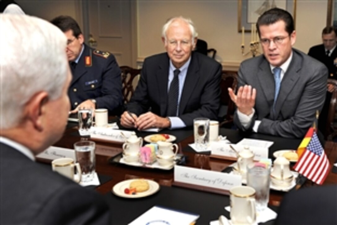 German Minister of Defense Karl-Theodor Zu Guttenberg, right, meets with U.S. Defense Secretary Robert M. Gates, left foreground, at the Pentagon, Nov. 19, 2009. Germany's Ambassador to the United States Klaus Scharioth, center, and Maj. Gen. Karl Mullner, left, chief of the political military division of the German Ministry of Defense, also participated in the talks.