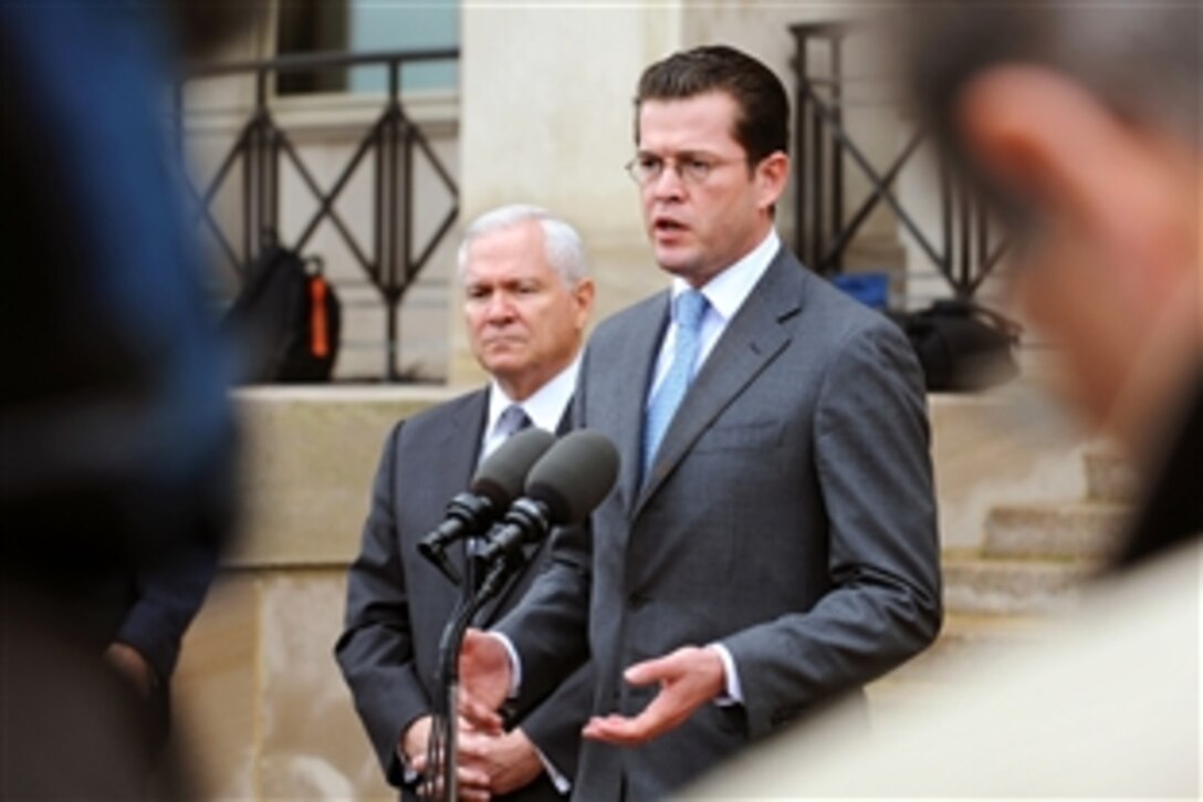 German Minister of Defense Karl-Theodor Zu Guttenberg, right, responds to a reporter's question during a press conference with U.S. Defense Secretary Robert M. Gates outside the Pentagon, Nov. 19, 2009. Earlier, the two defense leaders met in private and then held talks with some of their senior advisors. 