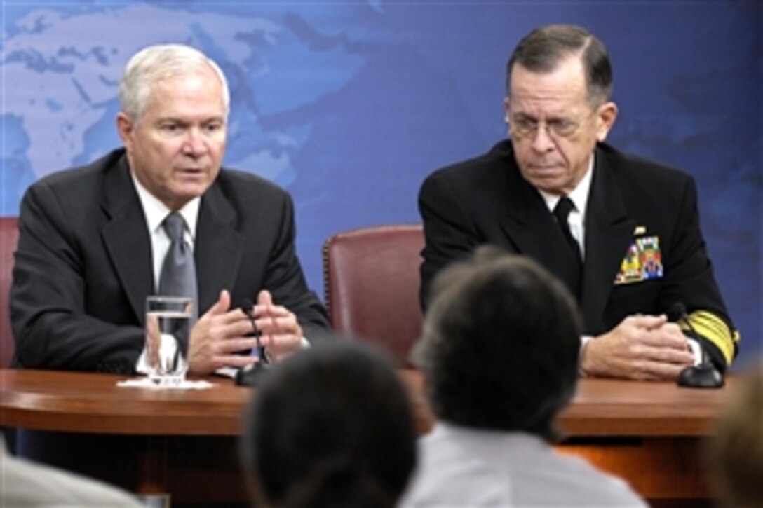 Defense Secretary Robert M. Gates and Navy Adm. Mike Mullen, chairman of the Joint Chiefs of Staff, talk to members of the press during a briefing at the Pentagon, Nov. 19, 2009.  